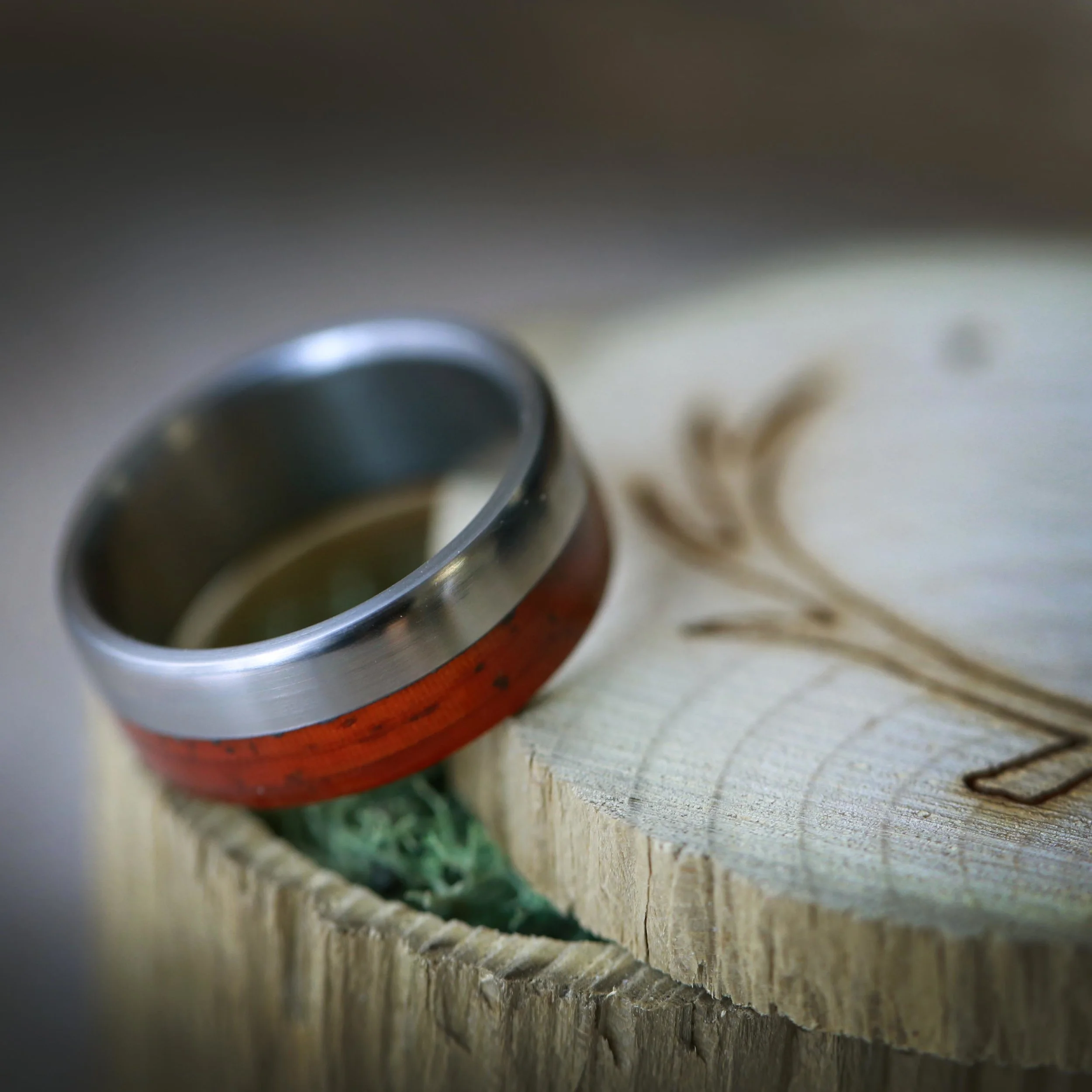 Red Wood Wedding Ring with Titanium Base. Handcrafted by Staghead Designs.