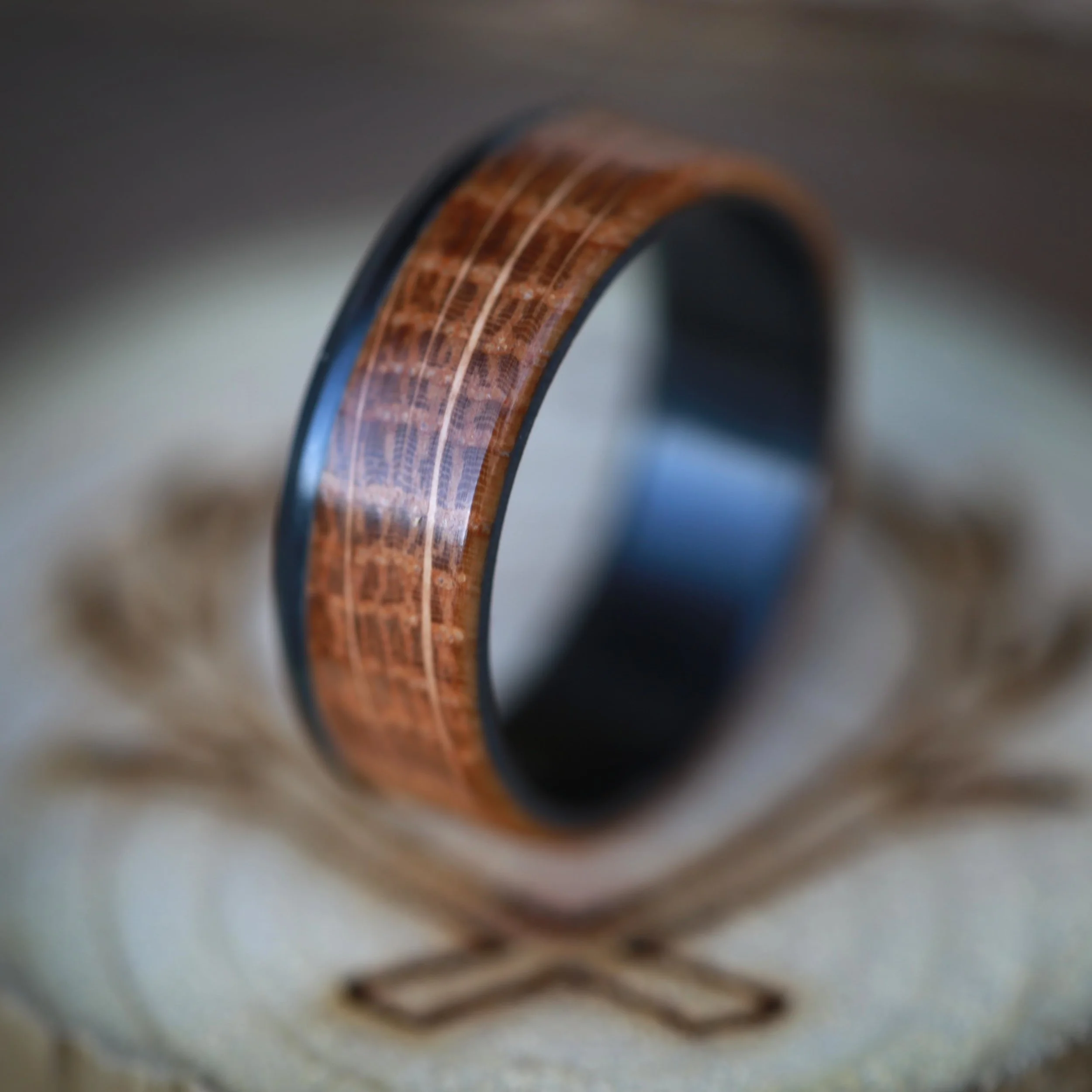 Black Wedding Ring with Whiskey Barrel Oak Wood. Handcrafted by Staghead Designs.