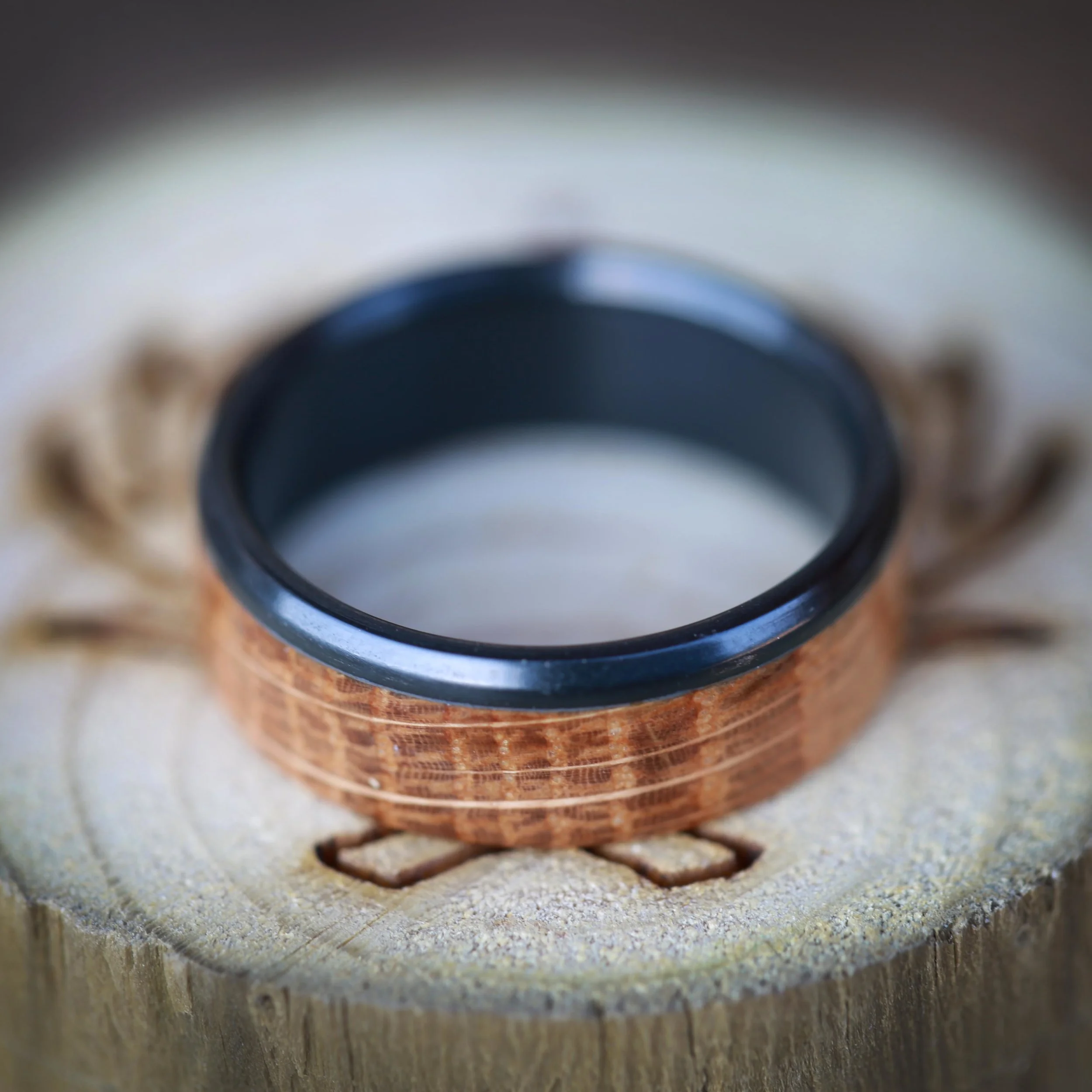 Custom Wedding Ring with Whiskey Barrel Wood and Black Zirconium. Handcrafted by Staghead Designs.