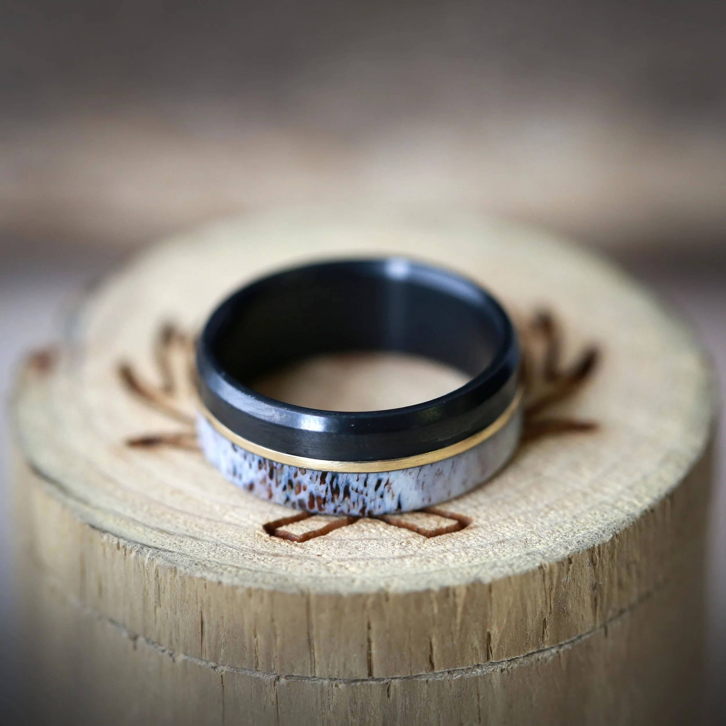 Antler Wedding Ring for Men with Black and Gold. Handcrafted by Staghead Designs.