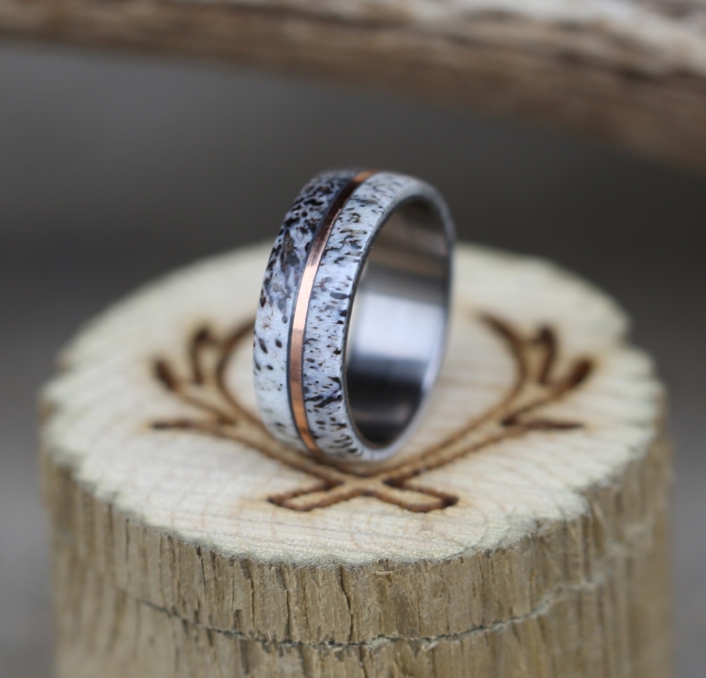 Men's elk antler wedding band with rose gold inlay.