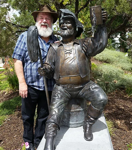 Actor John Ahlin with the Festival statue of the character he has been playing all season.