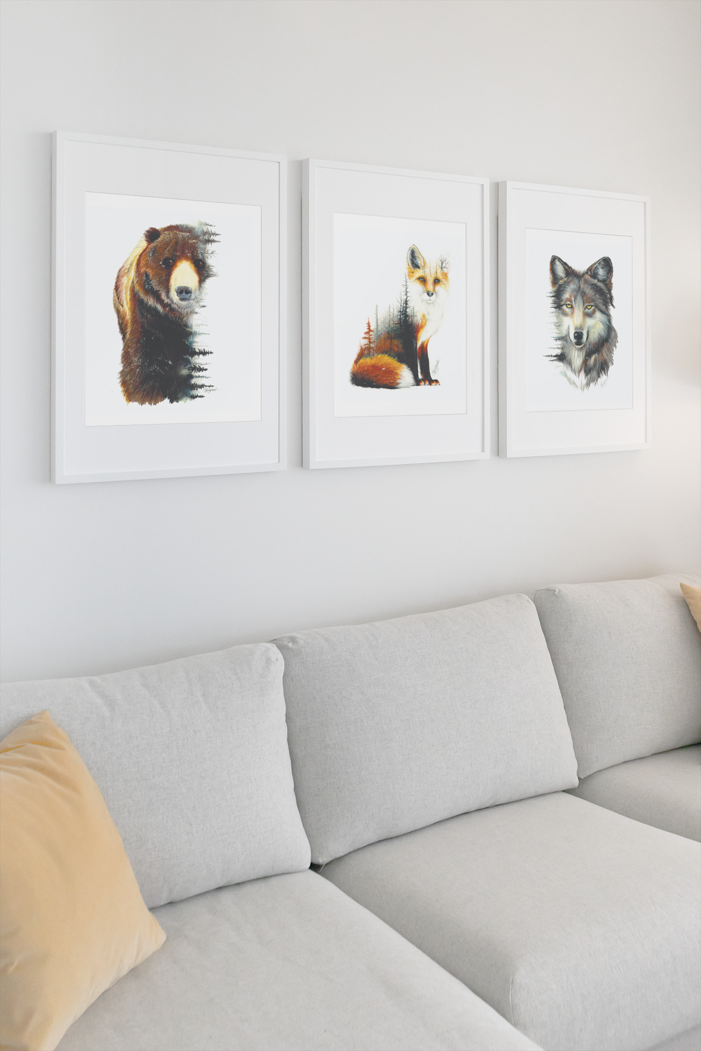 three white frames hanging on wall over couch, fox print, bear print, wolf print