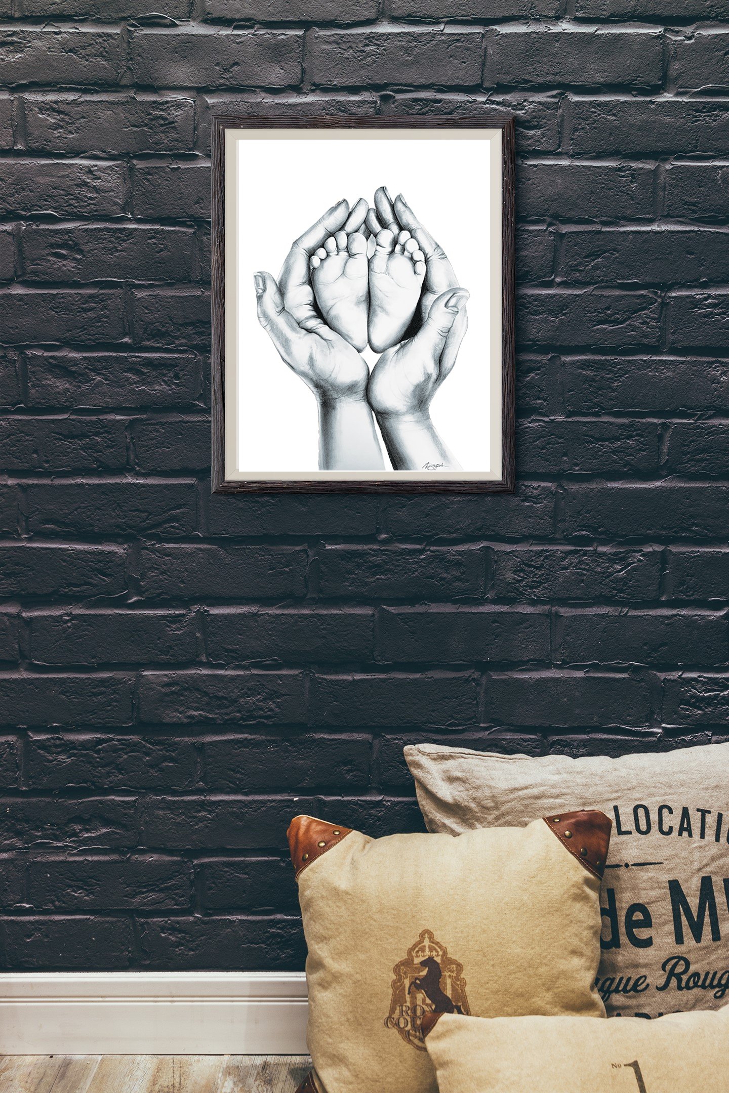 charcoal drawing of hands and feet in frame on wall over couch.jpg