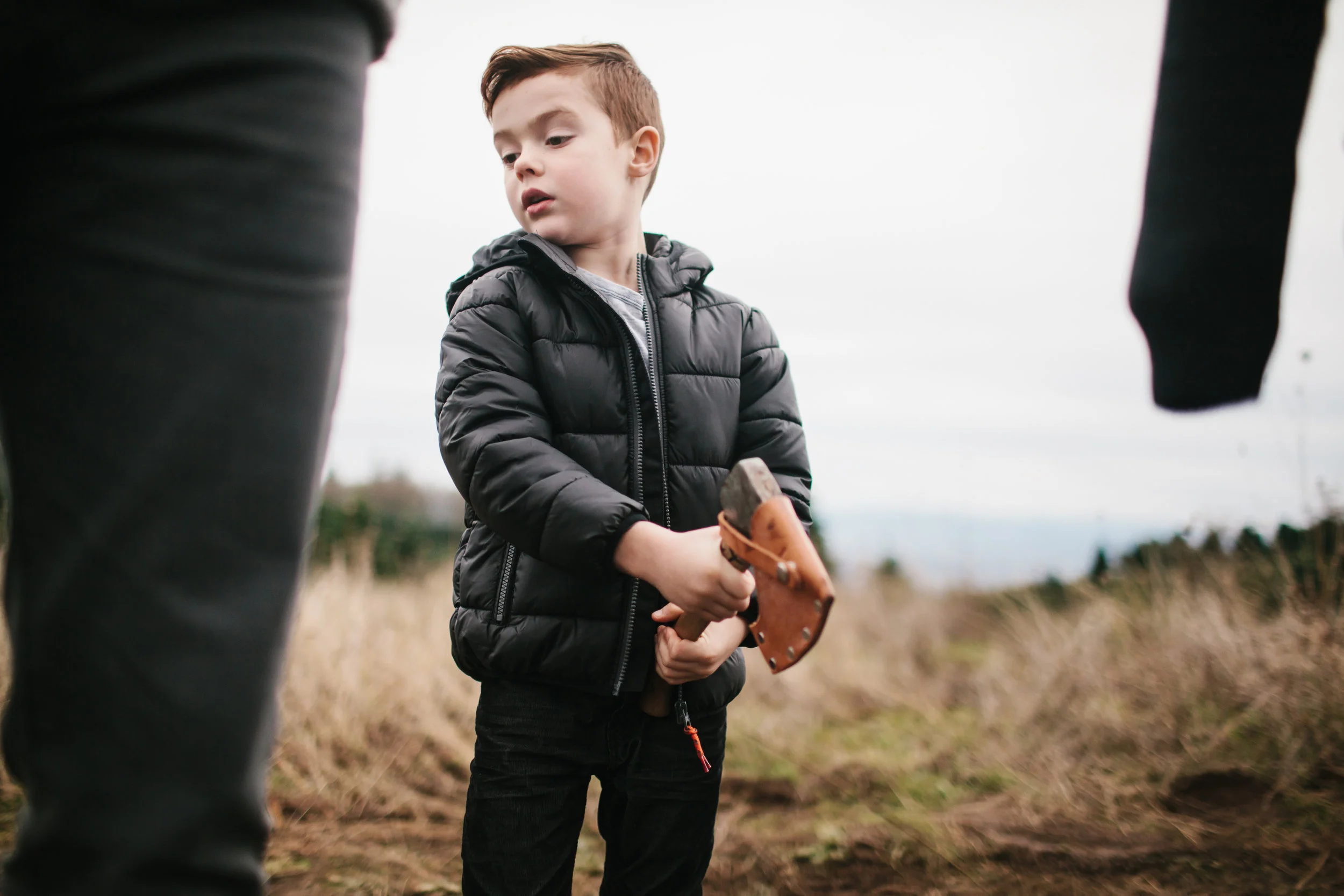 young boy holding axe