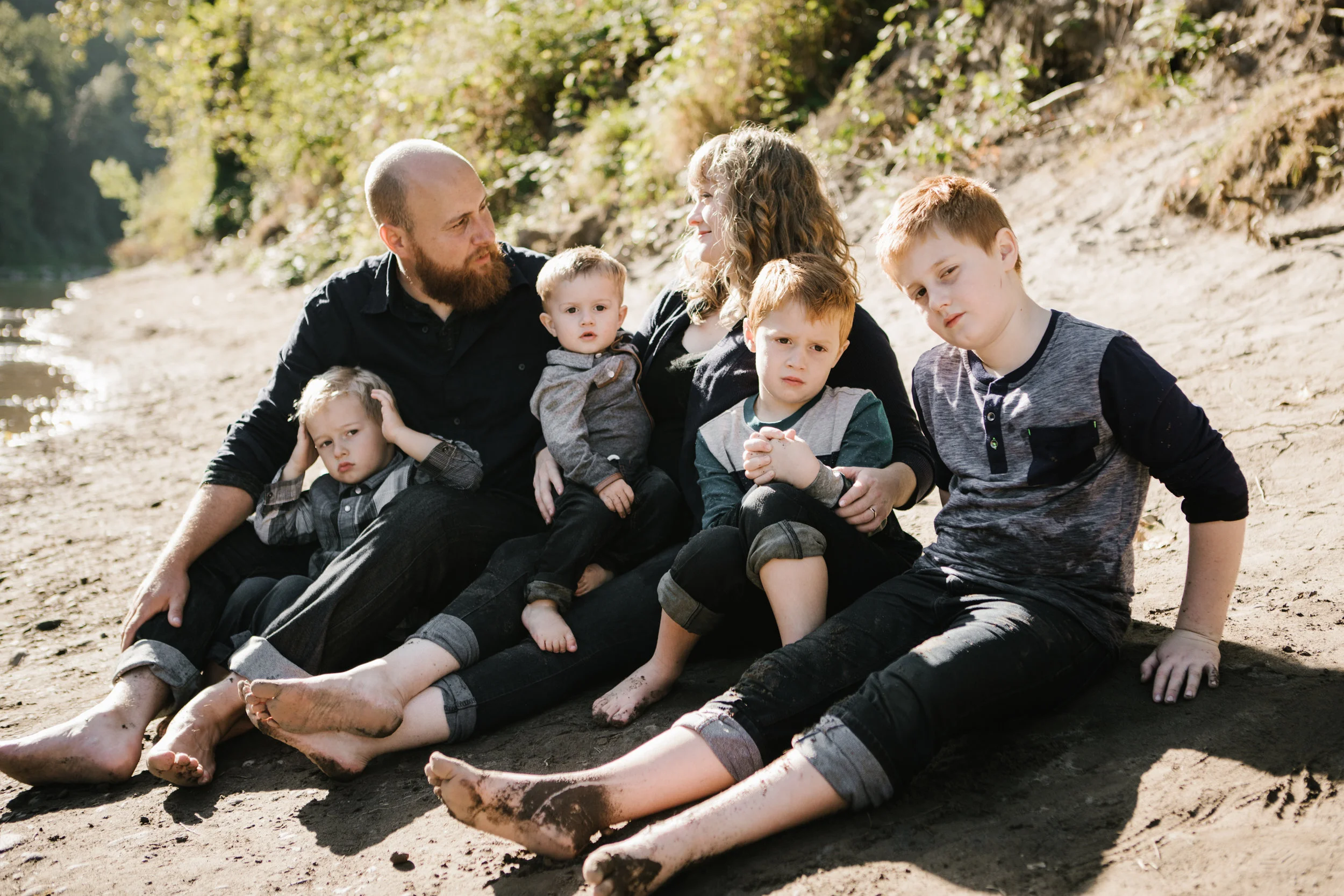 Young family of six portrait by river