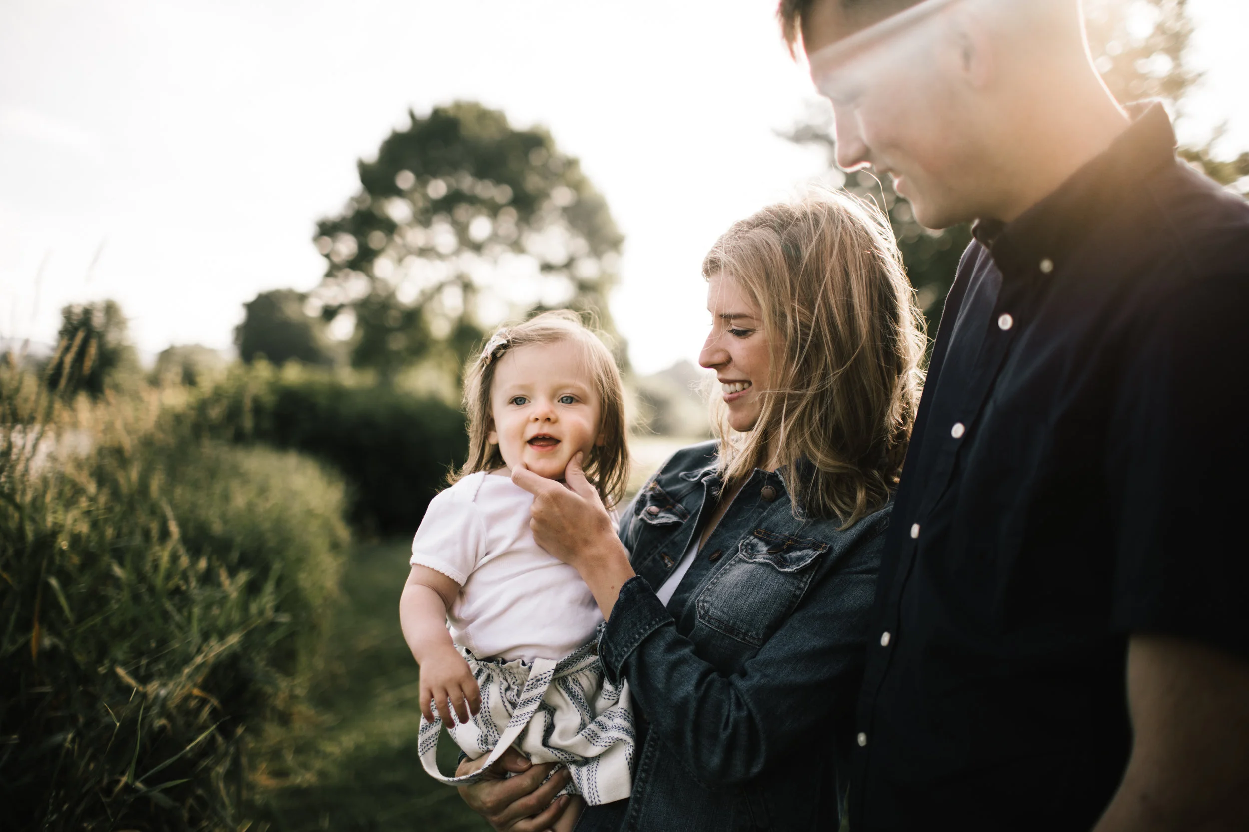 Parents holding toddler