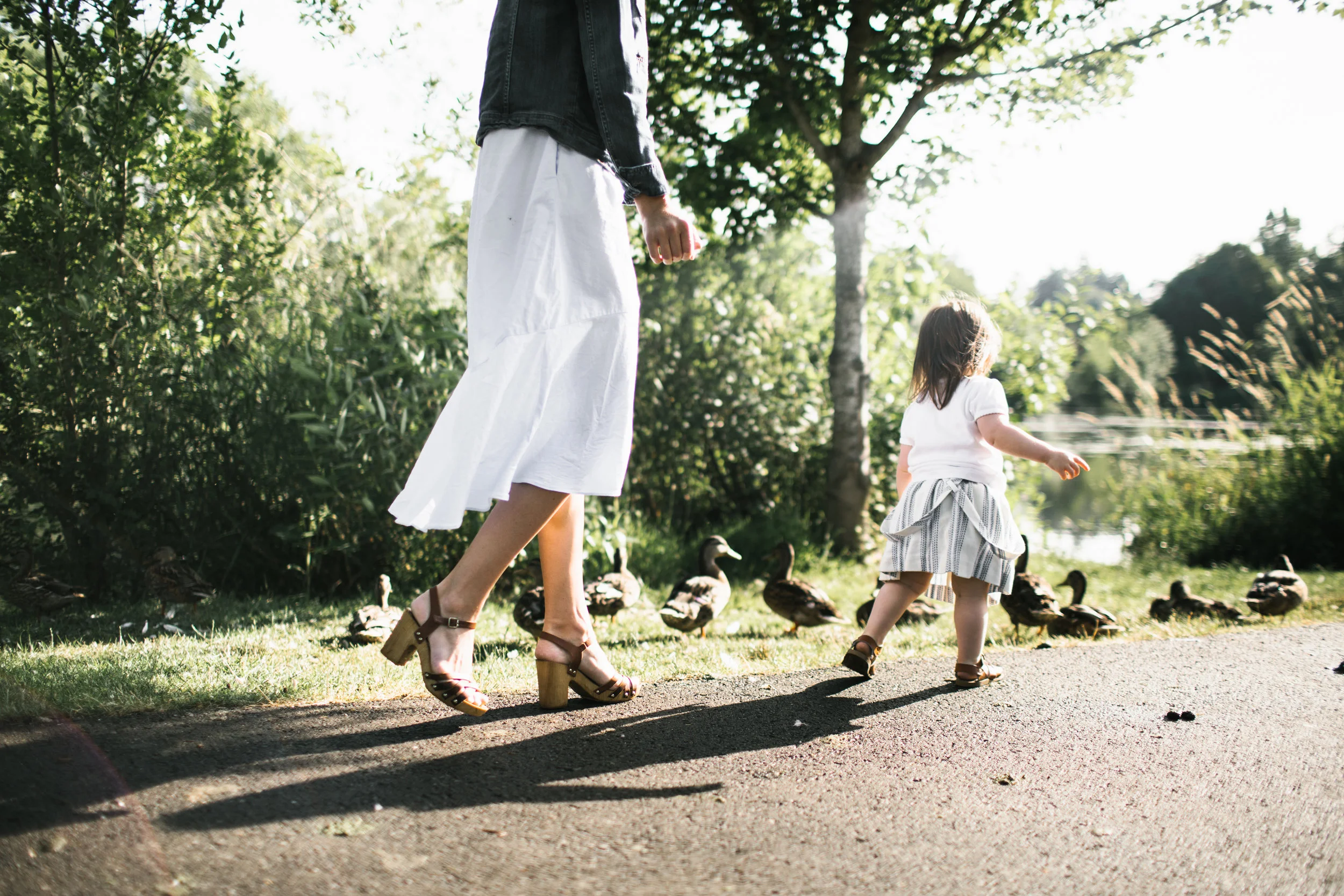 Toddler chasing ducks