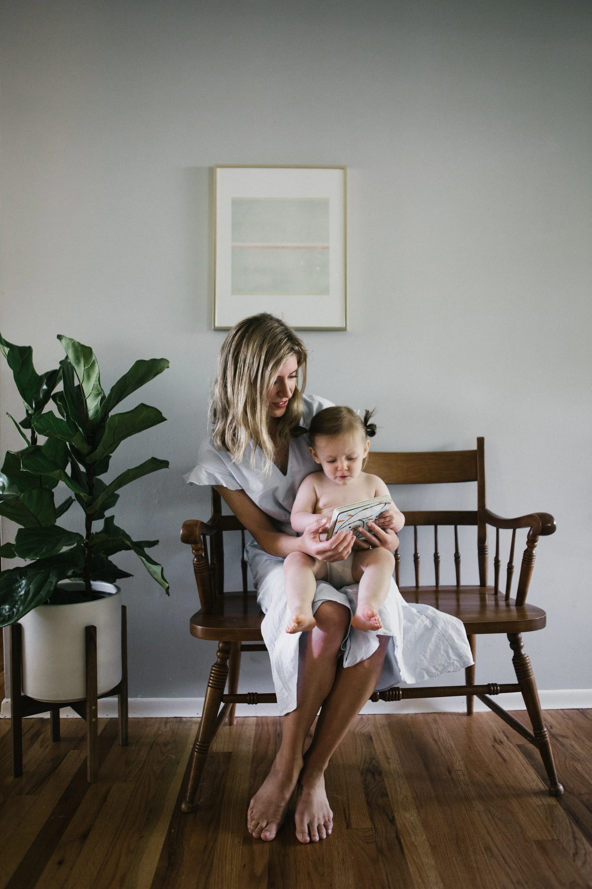 Mom reading a book to toddler