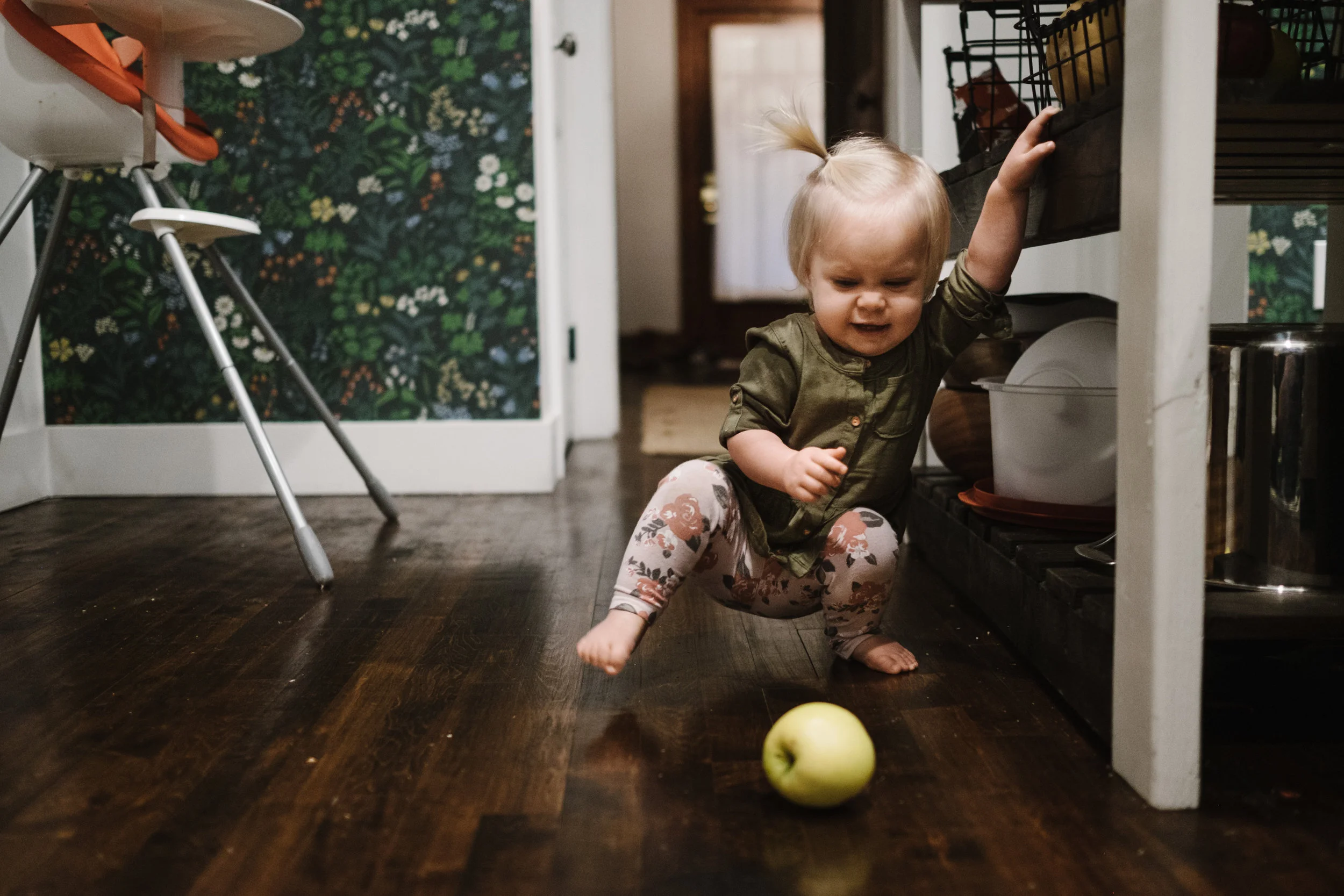 Baby playing with apple