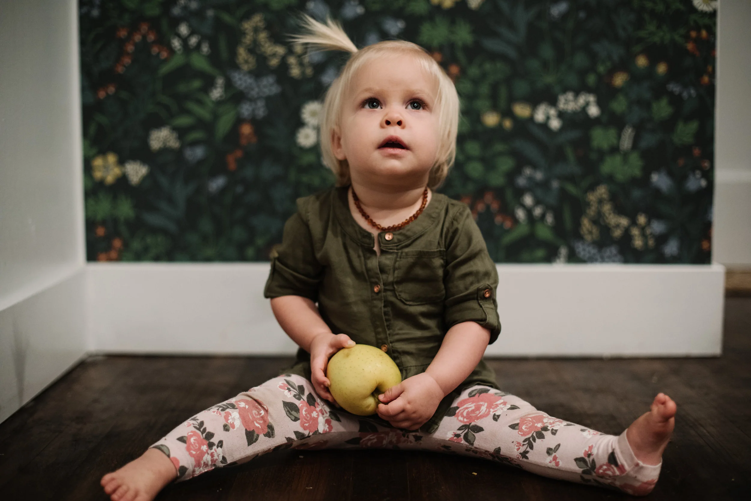 Baby holding apple
