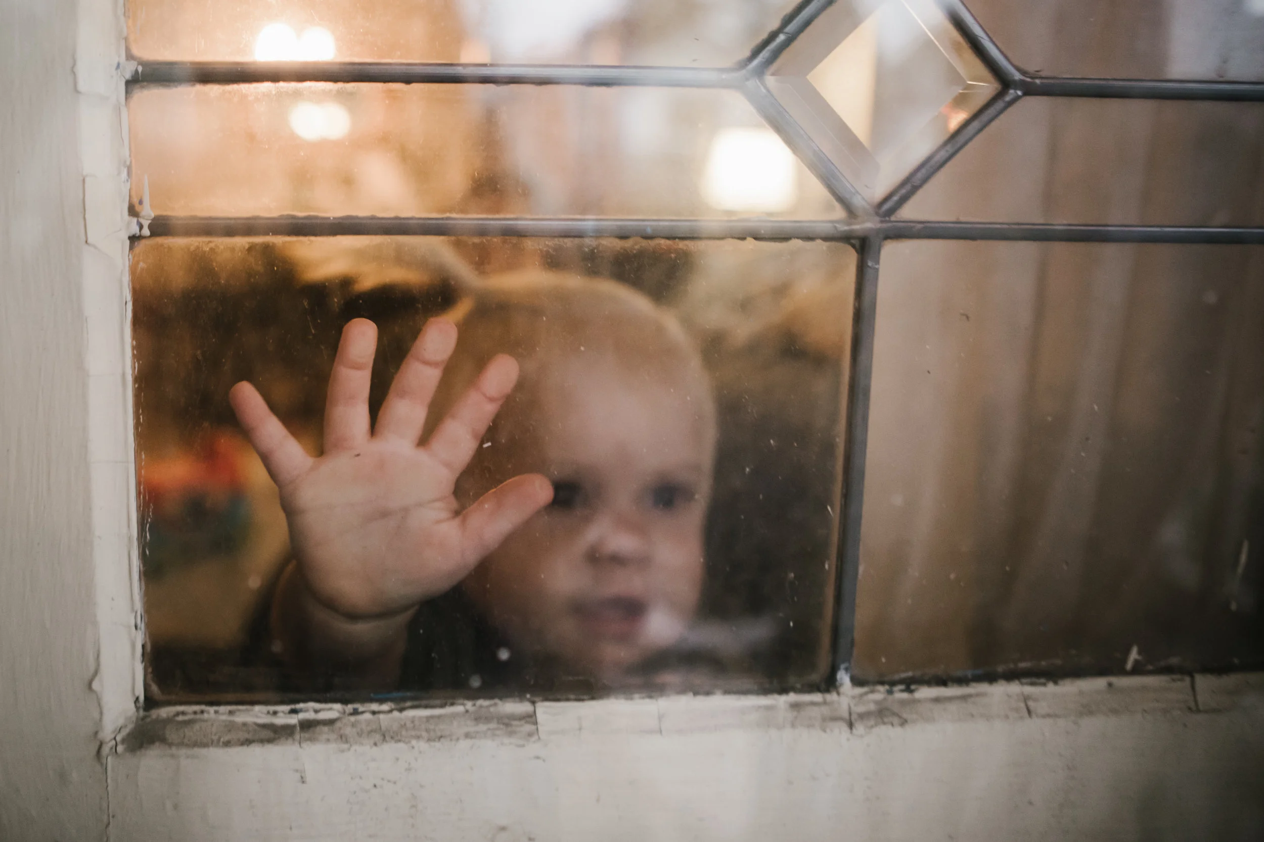 Baby looking out window
