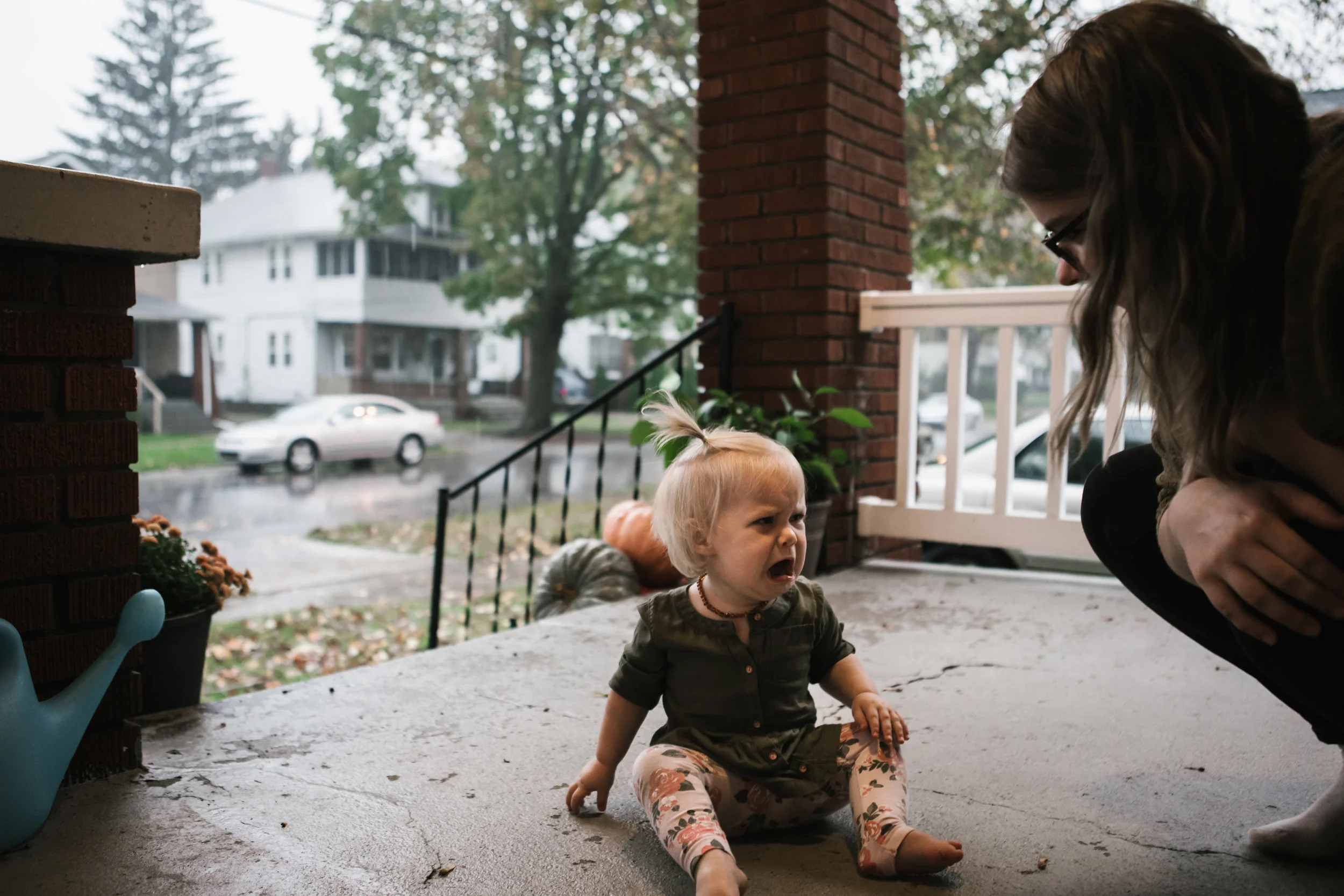 baby crying on porch