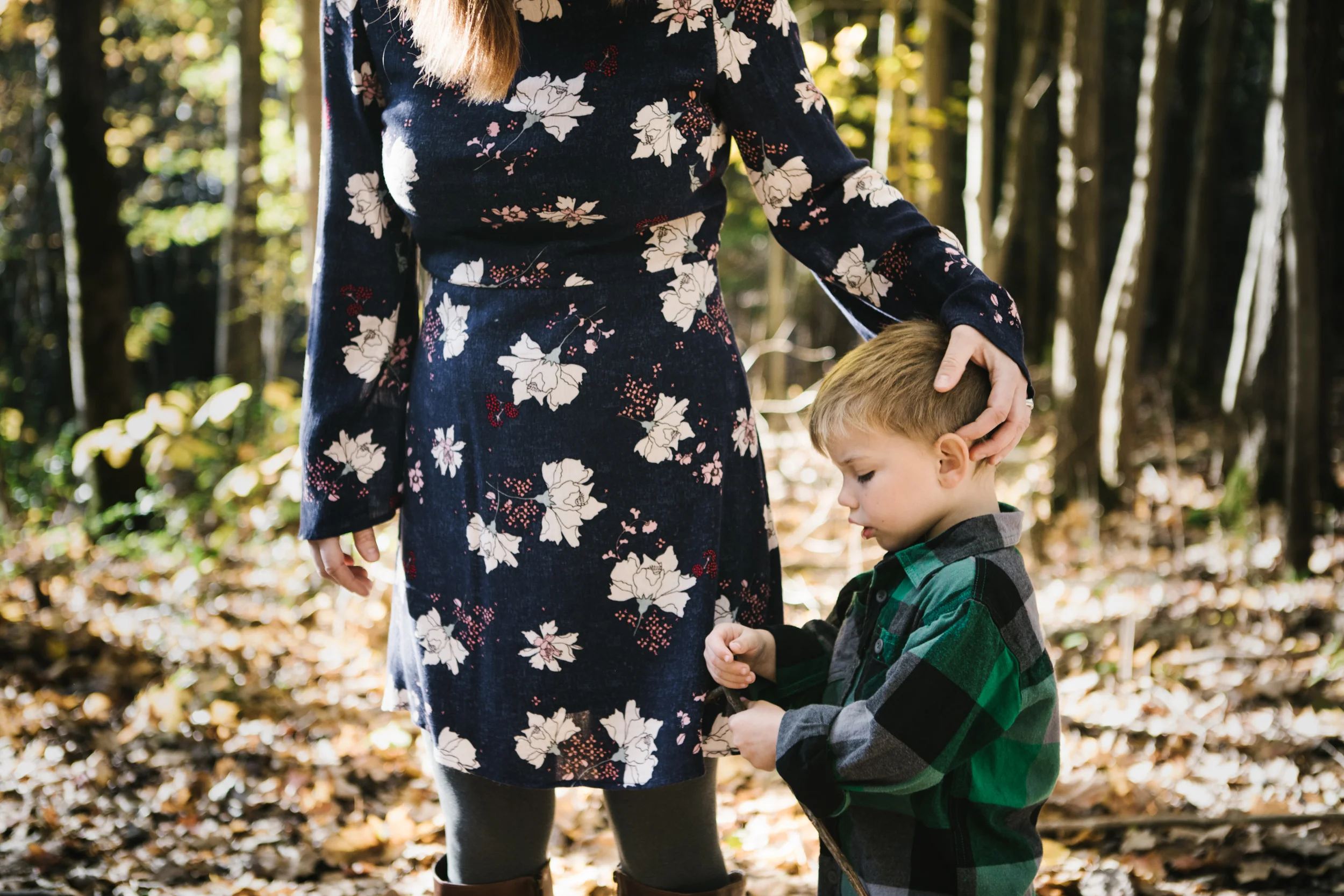 Mother with son in woods