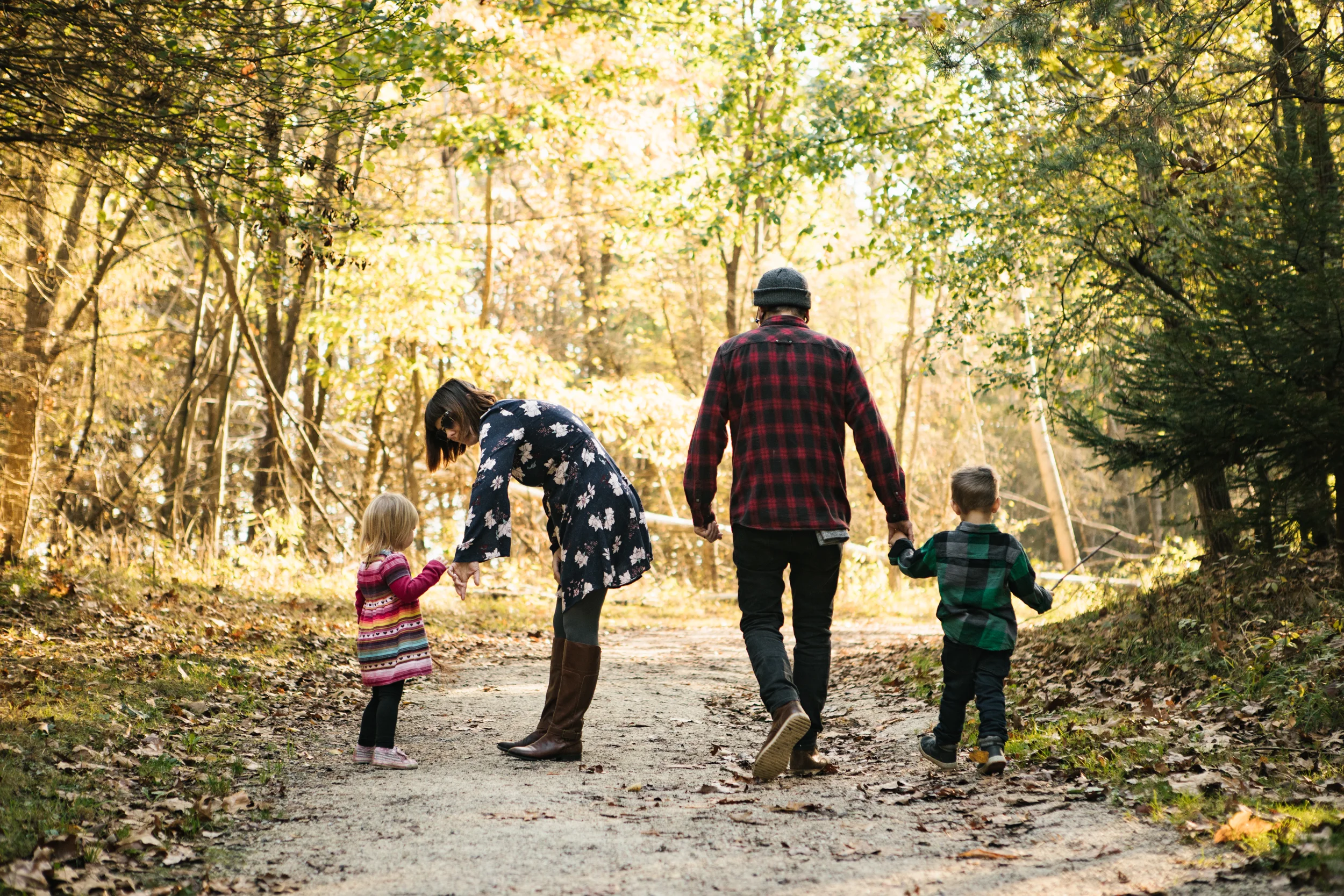 Family walking in woods