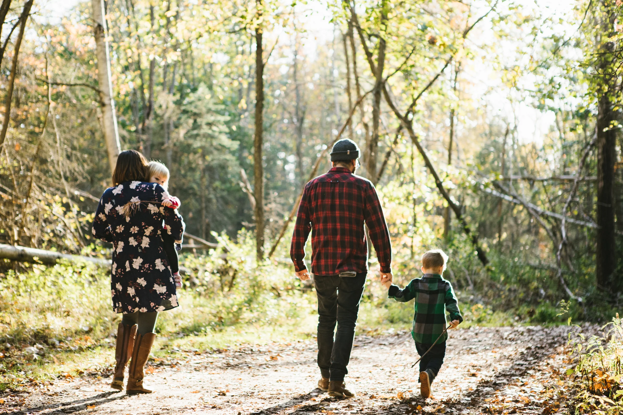 Family walking in woods