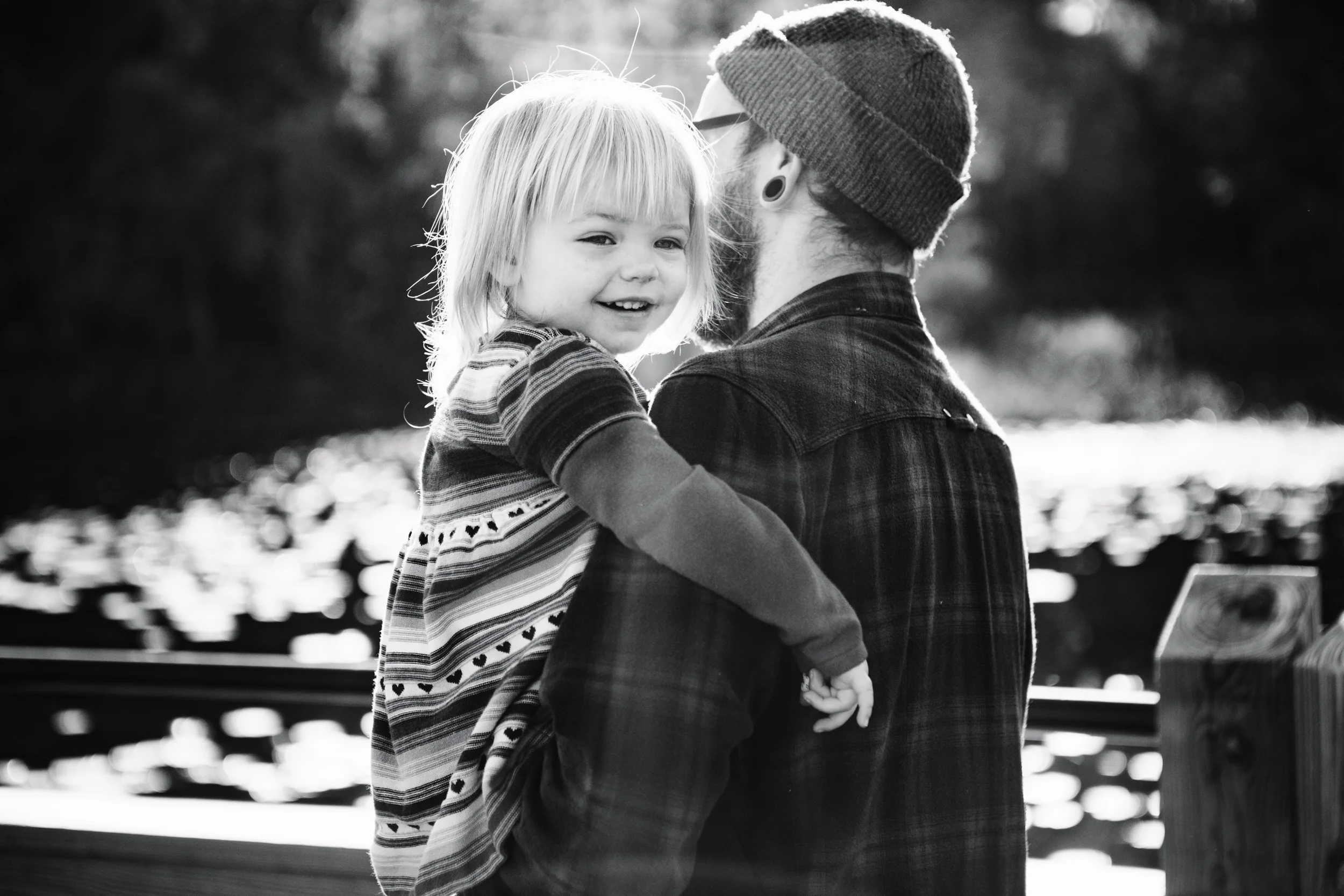 Smiling toddler in dads arms