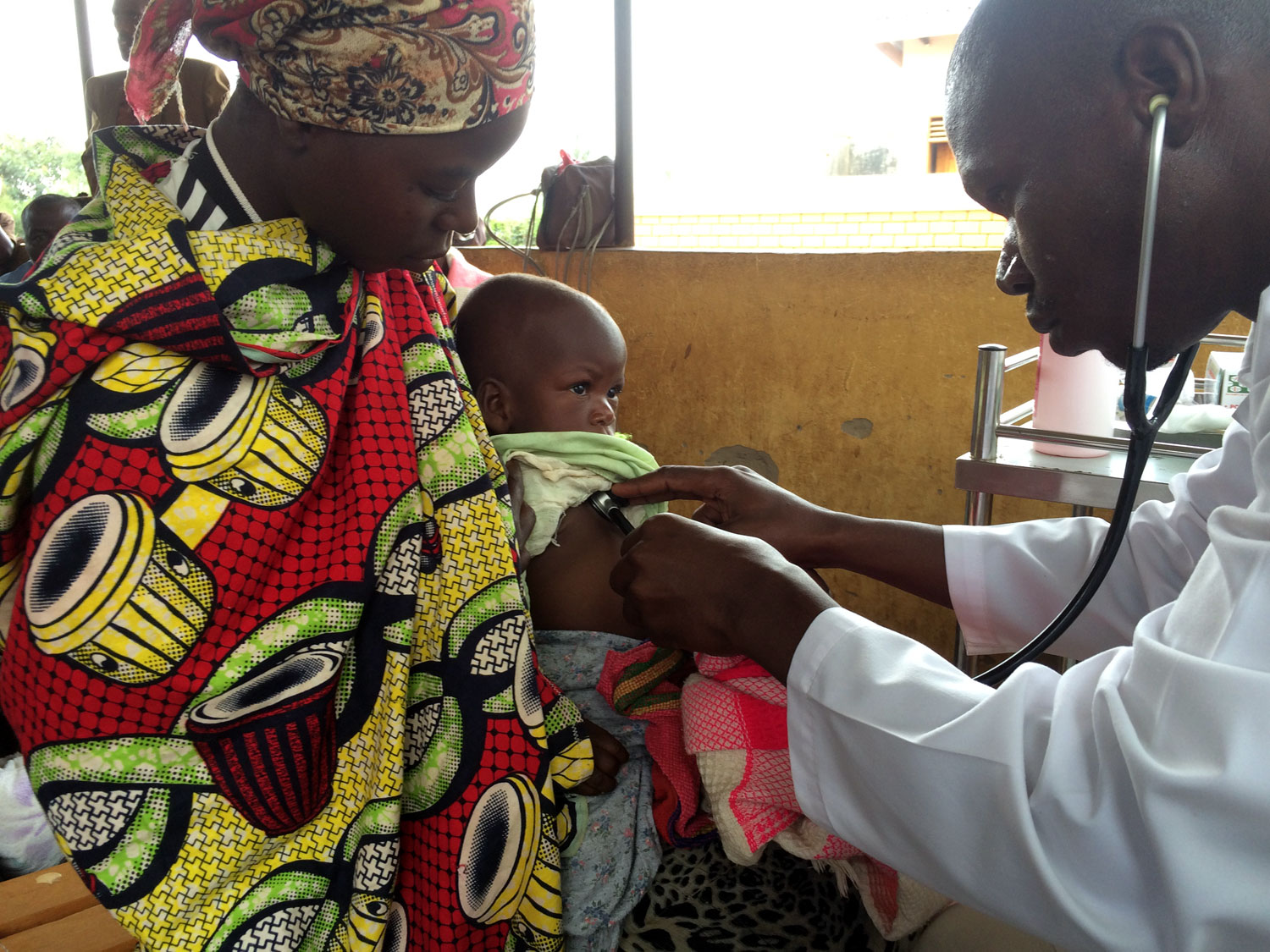 One of our Clinical Officers asesses a sick child