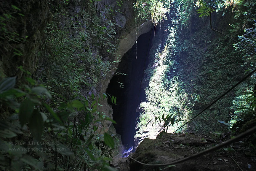 The entrance of Sótano de San Agustín lurks at the bottom of a large pit. 