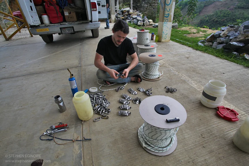 The time consuming process of putting mallions of bolt-hangers.