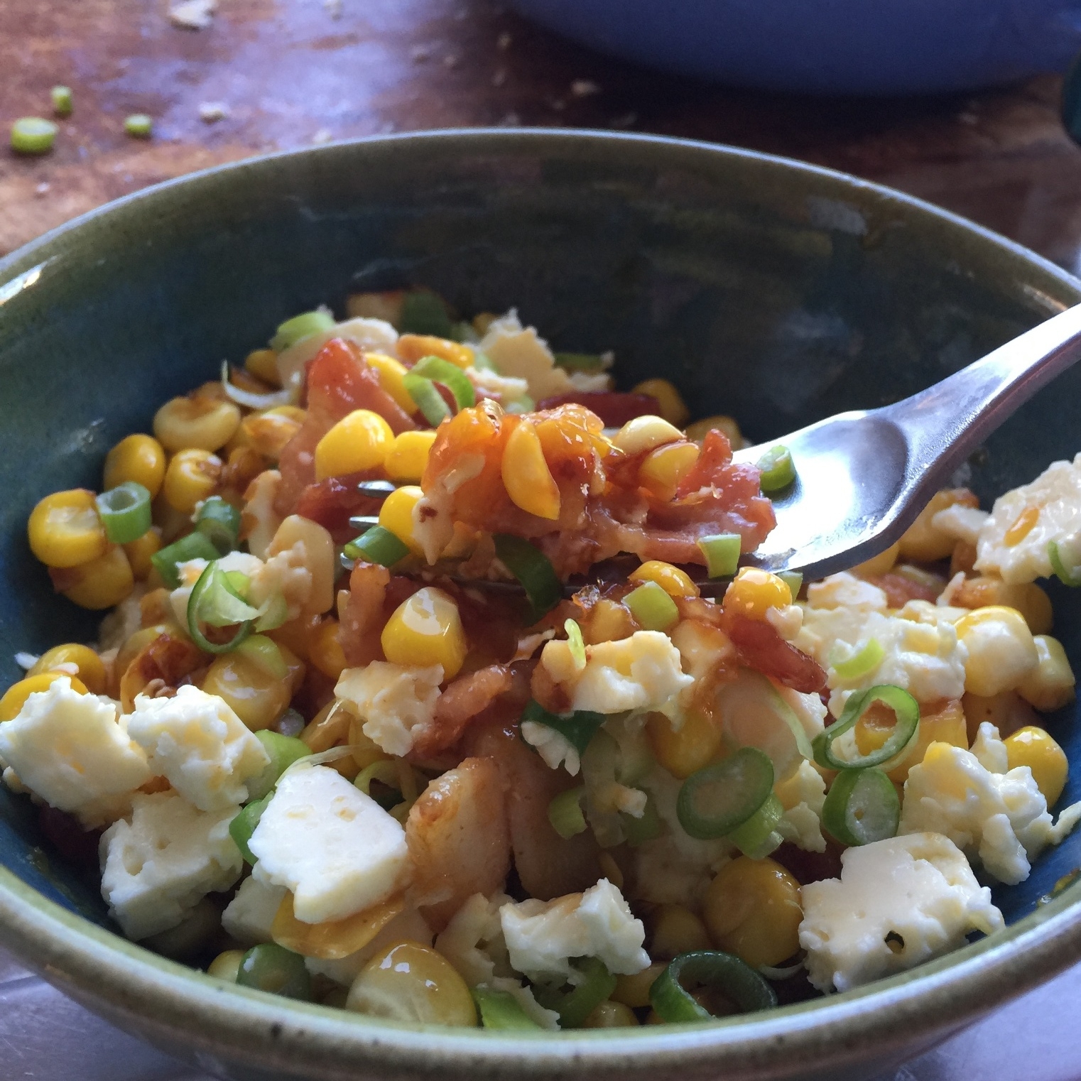 Sweetcorn, bacon and feta topped with buffalo sauce