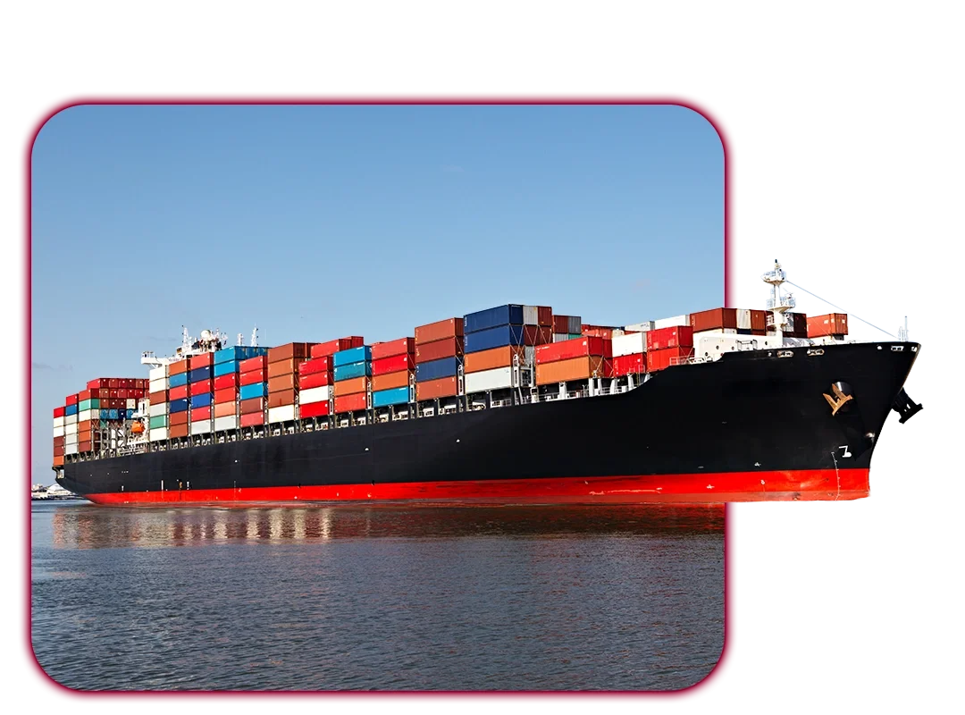 Large cargo ship carrying numerous multicolored shipping containers sailing on calm water under a clear blue sky.