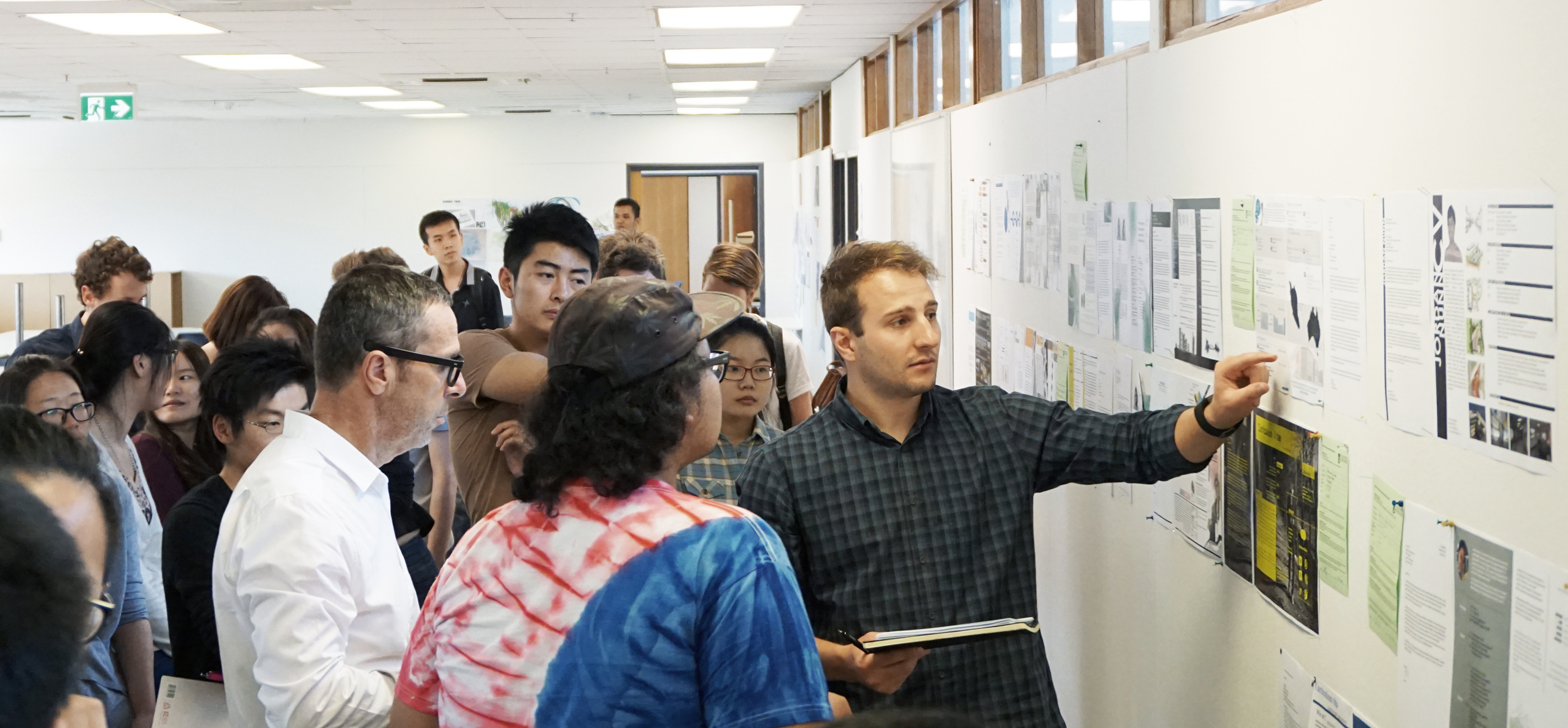Tectvs Director Francesco Bonato (left) and Graduate of Architecture Adrian Rossi (right) perform a critique of student's work at the University of Adelaide 