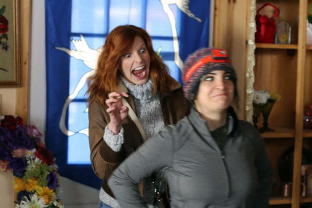 Tara having some fun with Best Boy Electric, Inga, on the Florist Shop set.