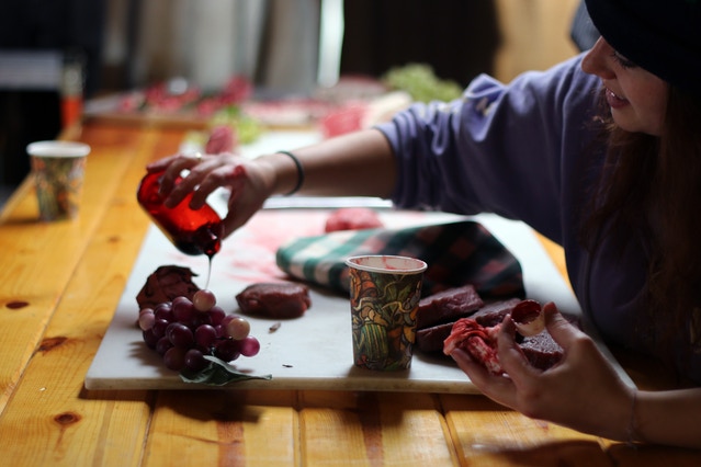 Art Director, Teagan, prepares props for the Butcher Shop.