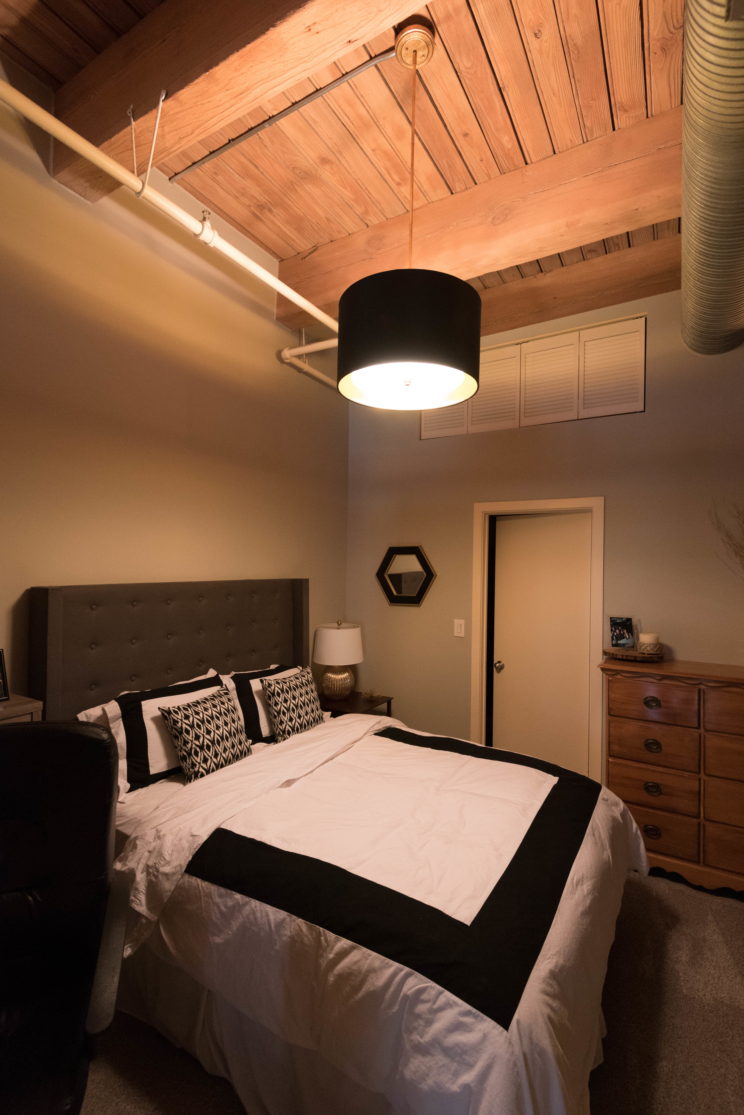 This fabric shade is really beautiful with a gold lined interior. The diffuser at the bottom of the fixture softens the light and gives the room warmth.
