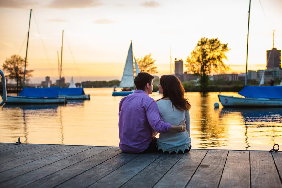 pretty couple on docks in boston engagement photography during sunset