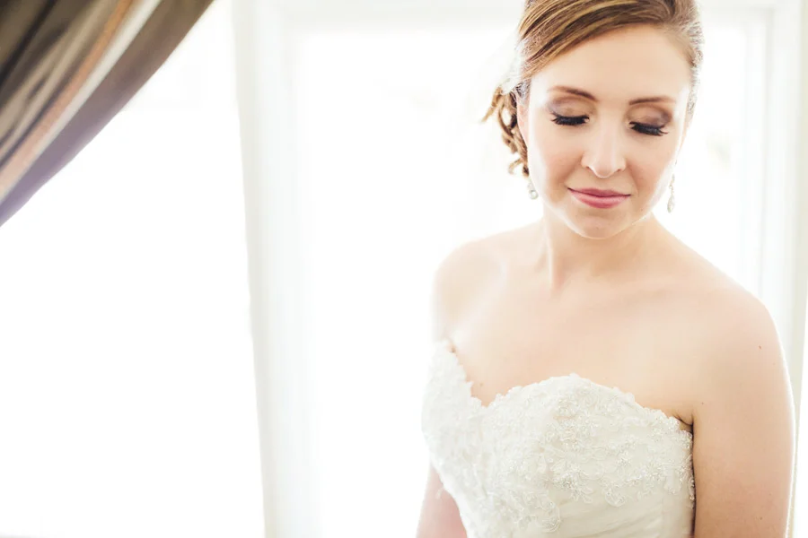stunning bride getting ready at the lighthouse court hotel in key west florida, wedding photographer