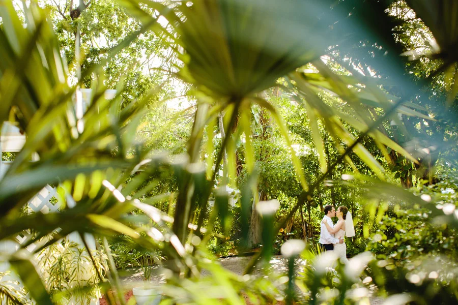 romantic creative portraits of bride and groom at the hemingway home in keywest, florida, destination photographer
