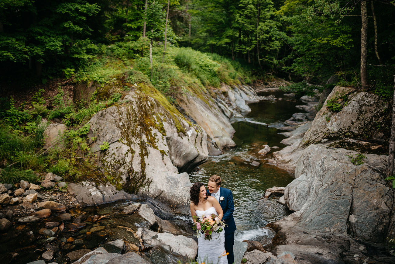 creative landscape portrait of a lovely bride and groom at the pitcher inn in warren vermont, vermont wedding venues