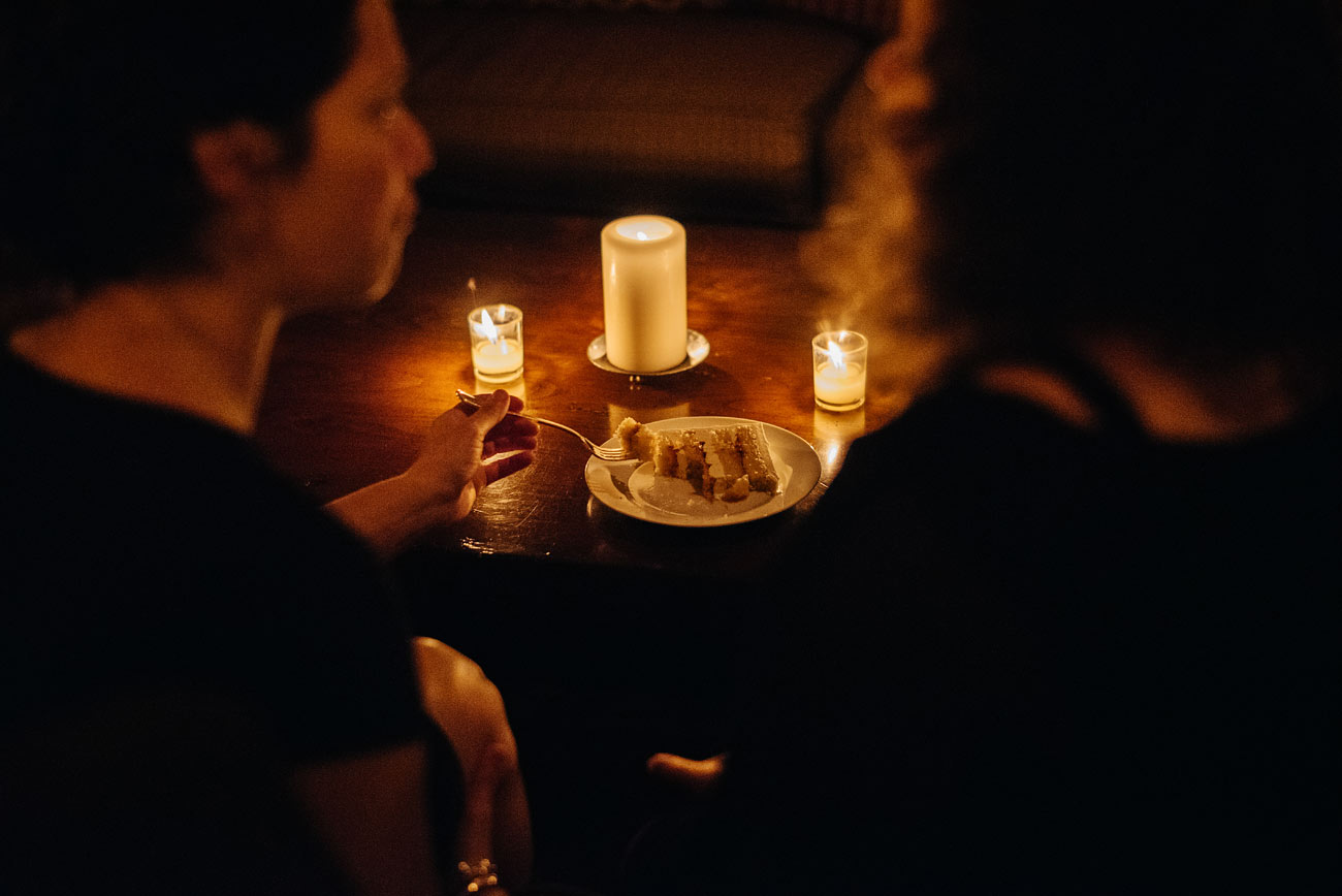 guests enjoying cake at the bar during a pitcher inn vermont wedding rustic weddings