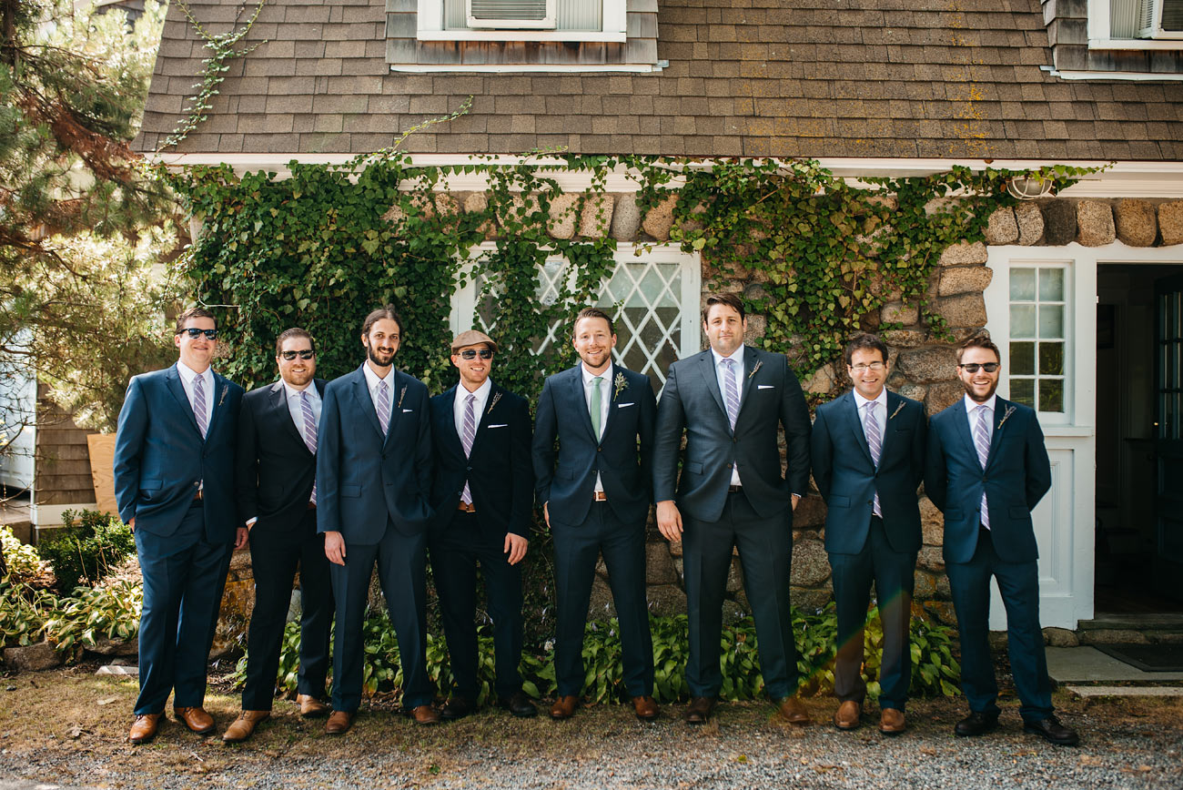 groomsmen hanging out casually at the eastern point yacht club gloucestor, ma wedding photographers