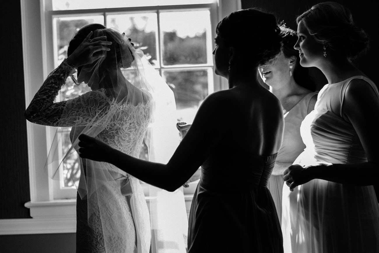 bride and bridesmaids wedding in groom getting ready in a michigan wedding eve at the b.o.b. in michigan