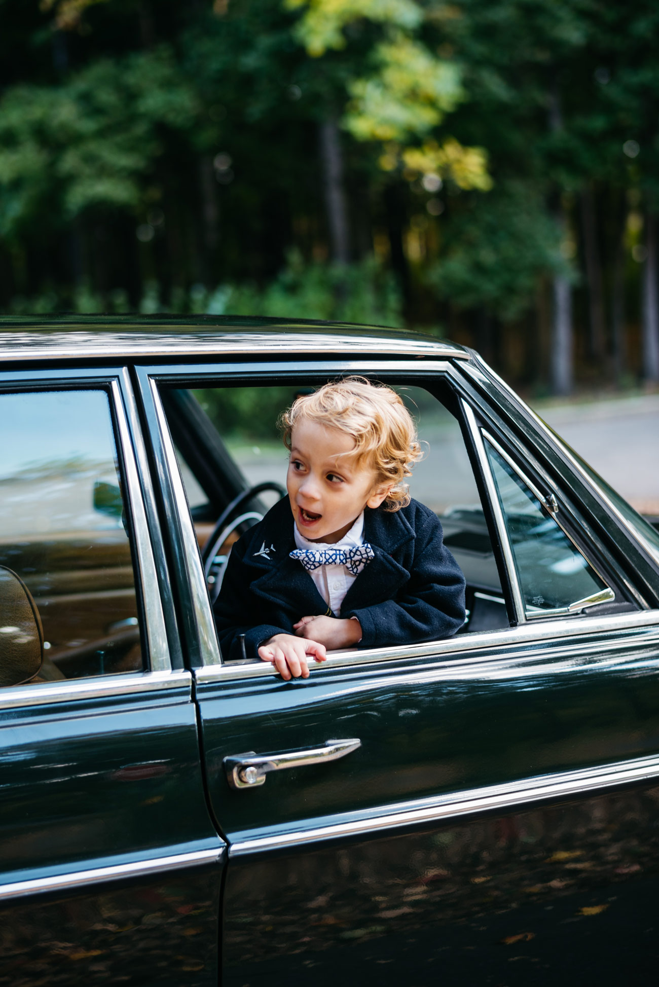 cute kid in car vintage mercedes lifestyle at aquinas college