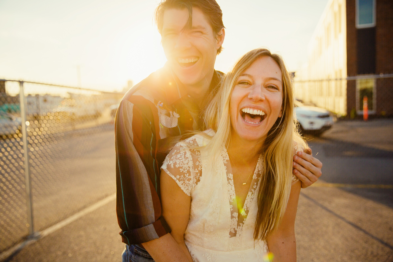 lifestyle couple in boston having fun and smiling during sunset