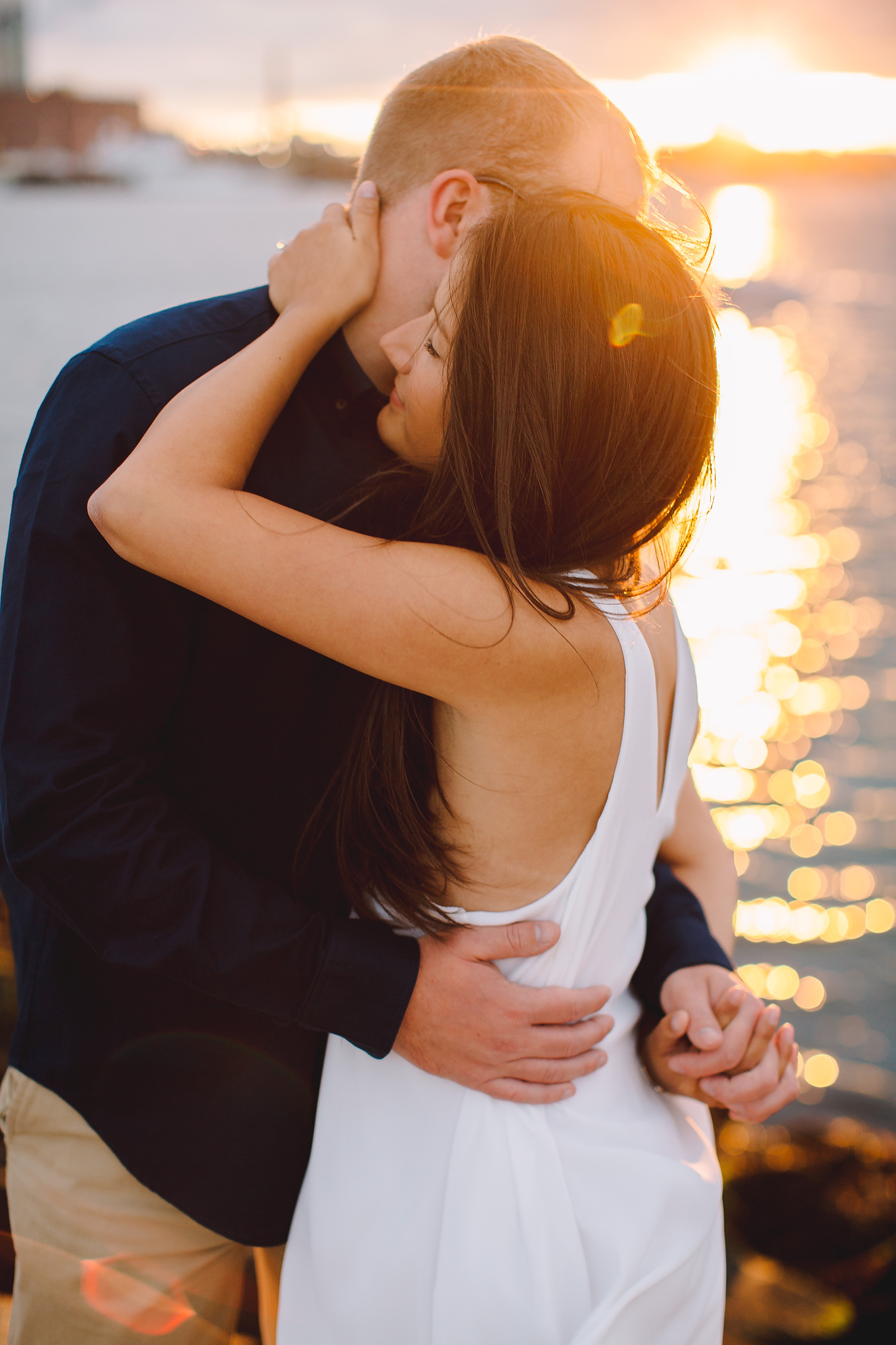 cute couple at their sunset engagement in boston