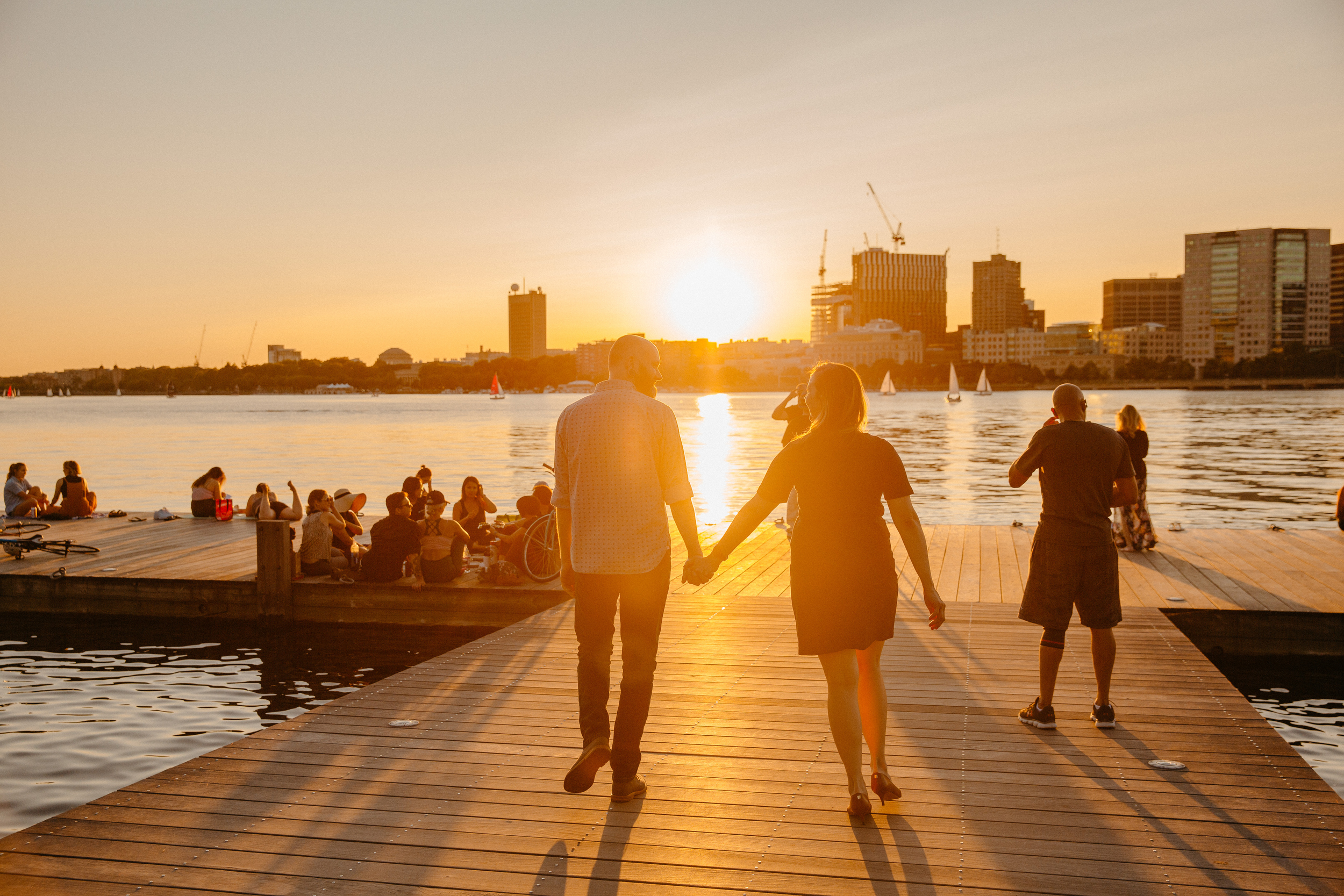  stunning golden sunset on the docks at the charles river esplande in downtown boston 