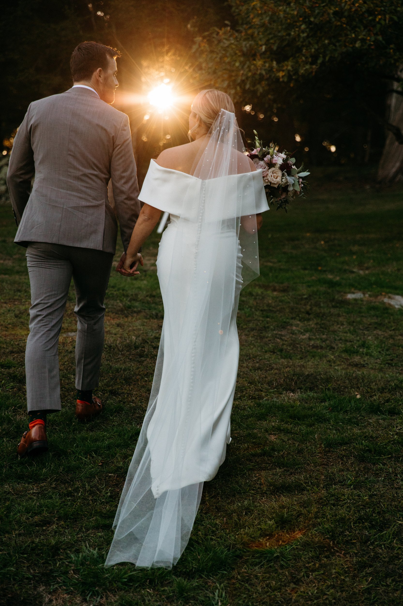 Glastonbury Abbey and Cohasett Golf Club Luxury tent wedding in early fall stylish bride and groom with oysters for placement cards and golden sunset vibes in an editorial documentary style