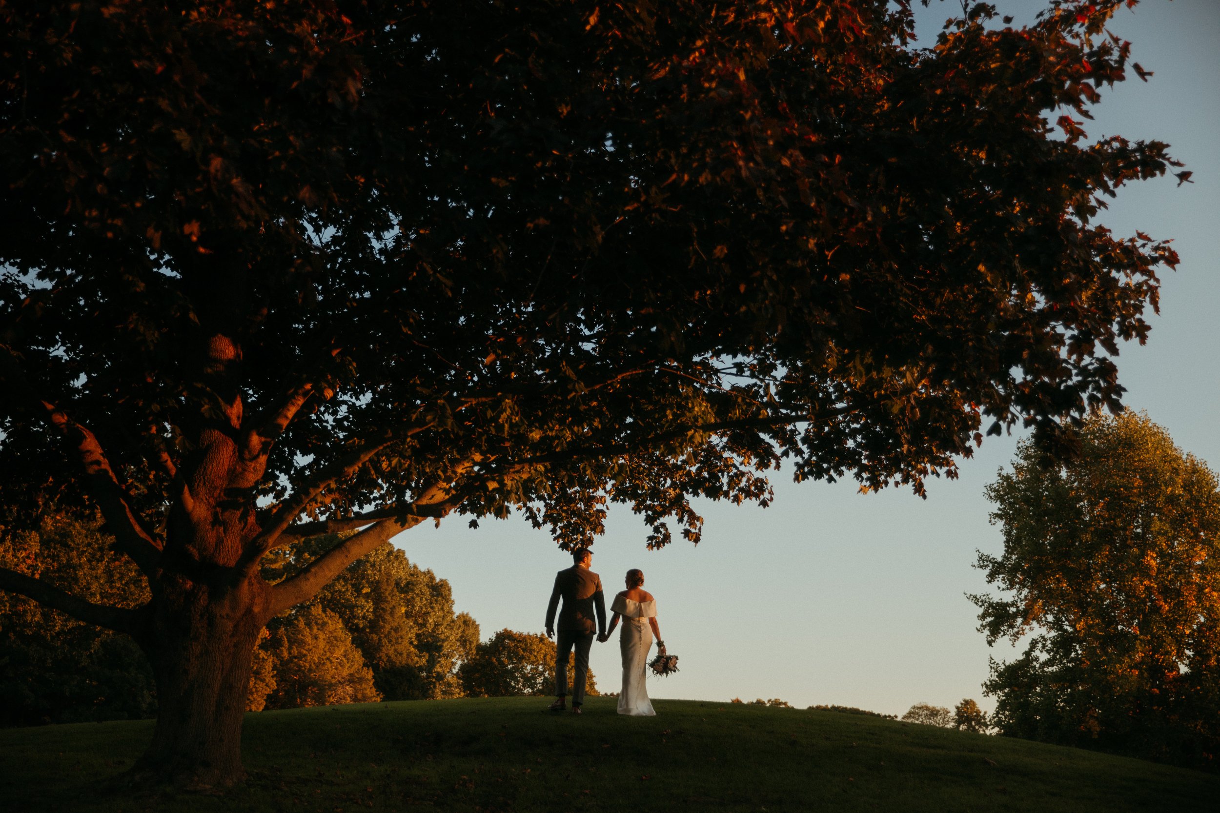 Glastonbury Abbey and Cohasett Golf Club Luxury tent wedding in early fall stylish bride and groom with oysters for placement cards and golden sunset vibes in an editorial documentary style