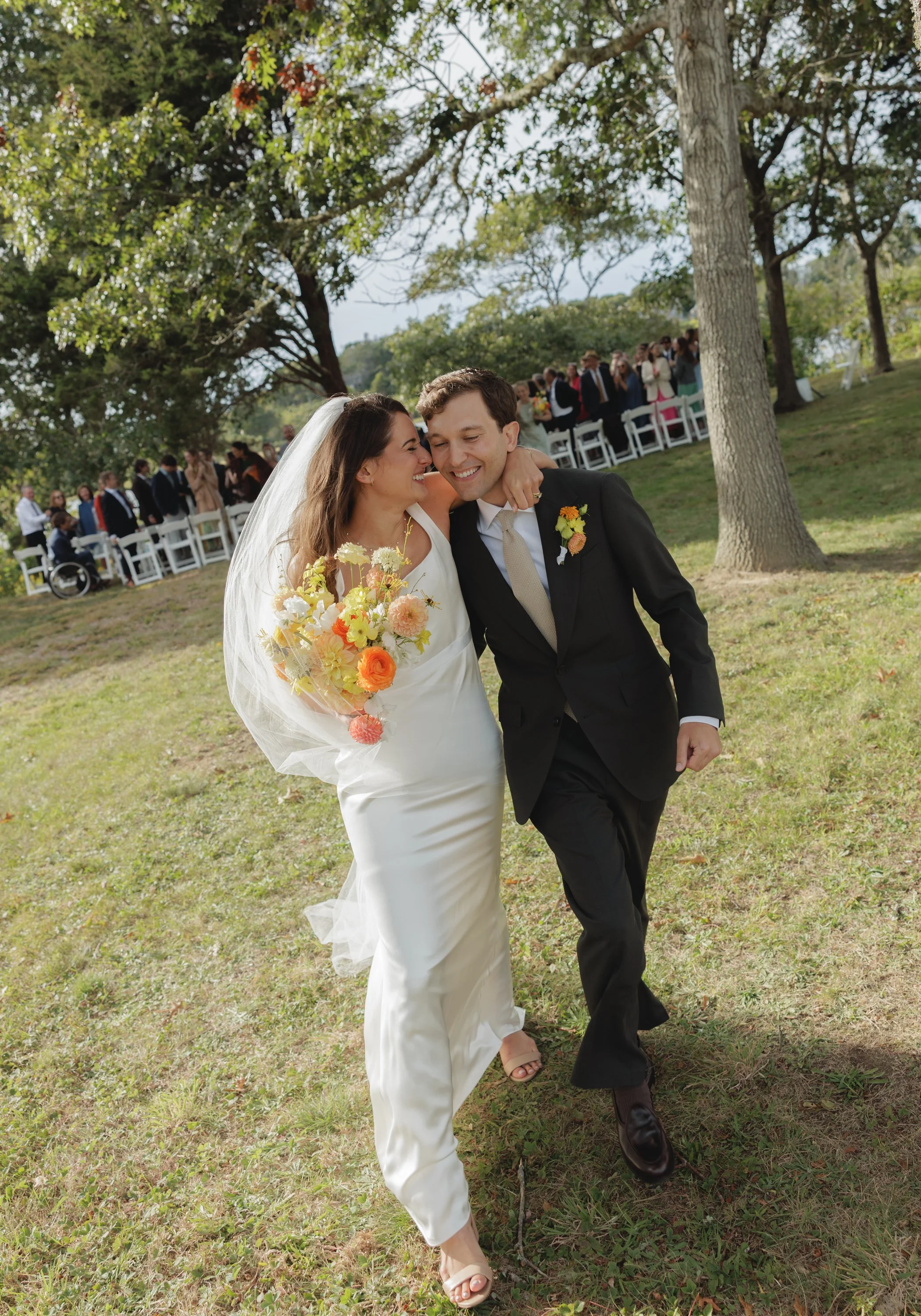 cape cod fall wedding in chatham ad the underwood estate bride snuggling groom after ceremony