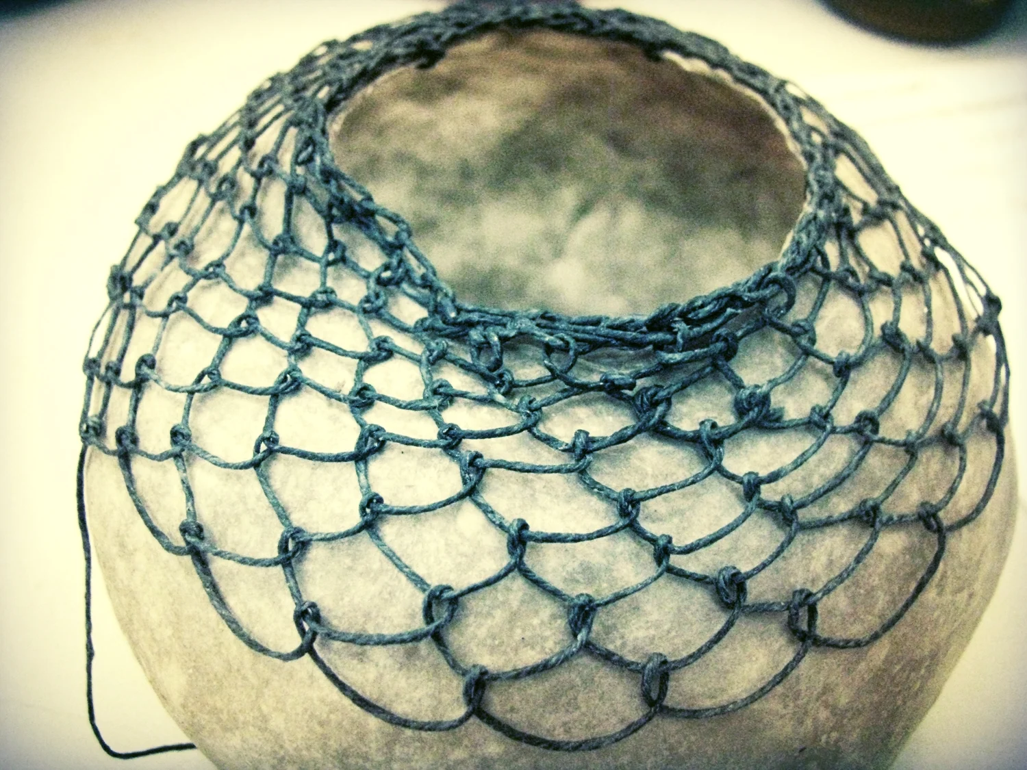 knotless knitting demo on handmade paper vessel by Tamaryn