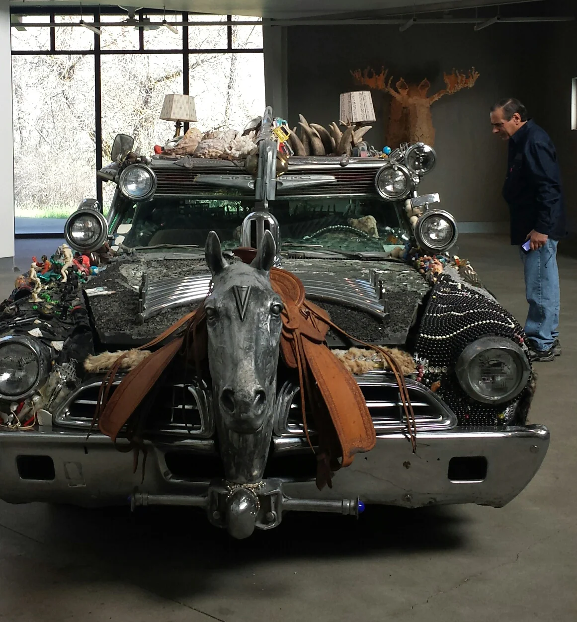 My dad examines the art car in the main gallery
