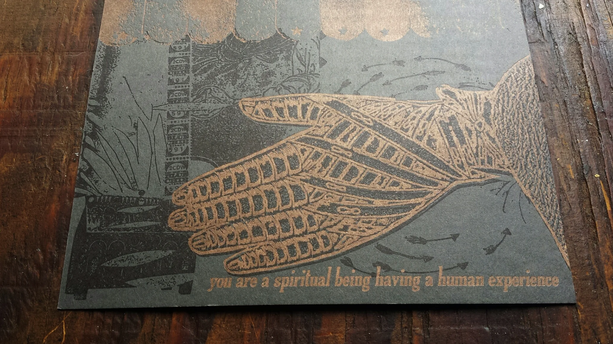 Keep Writing number 74, gold and black on grey paper