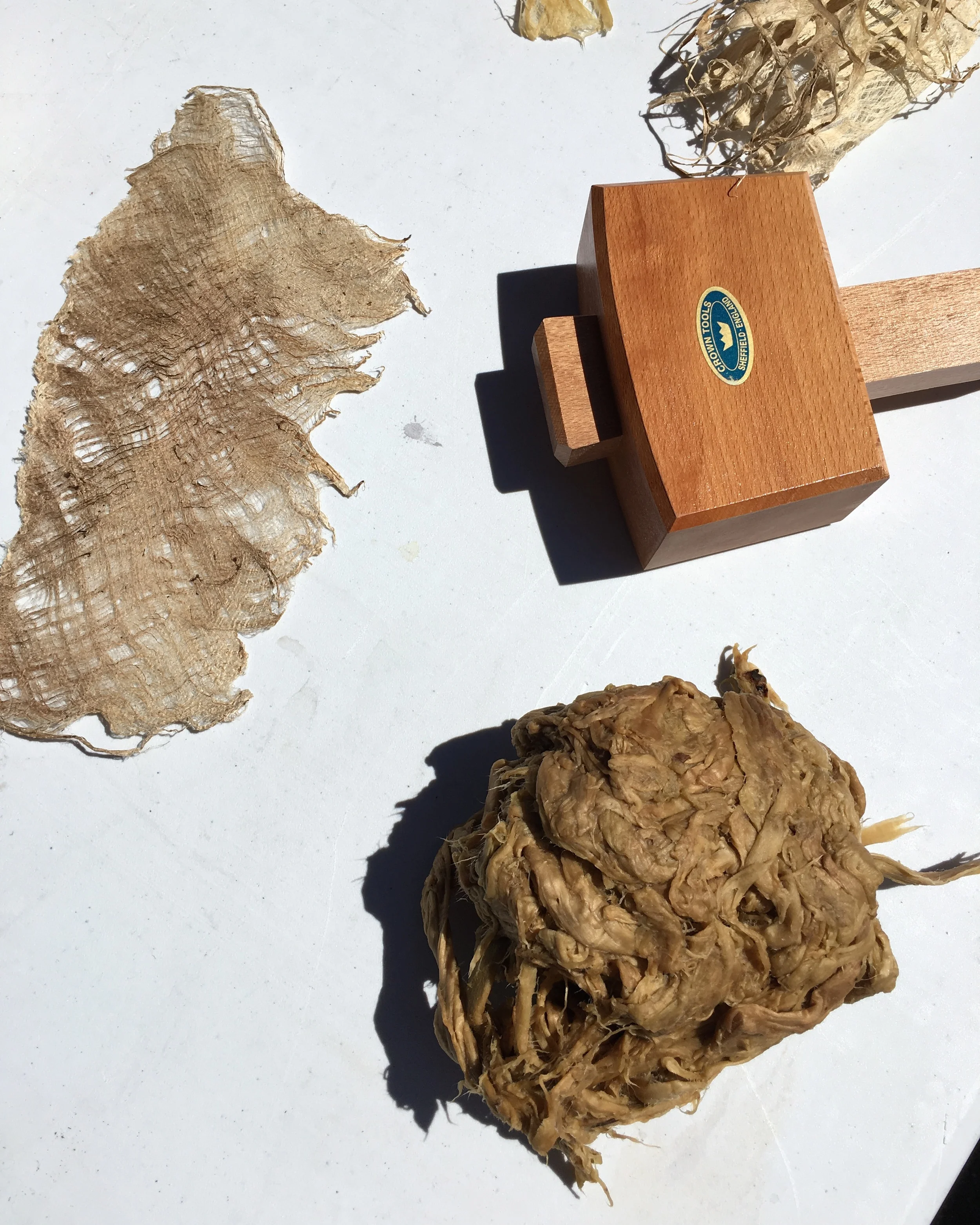 kozo fiber wet and ready for beating and an example of what the dried fiber can look like without beating.