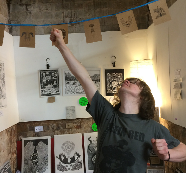 Steve selling prints at Nottingham Writers Studio. Photo by Tara Hill