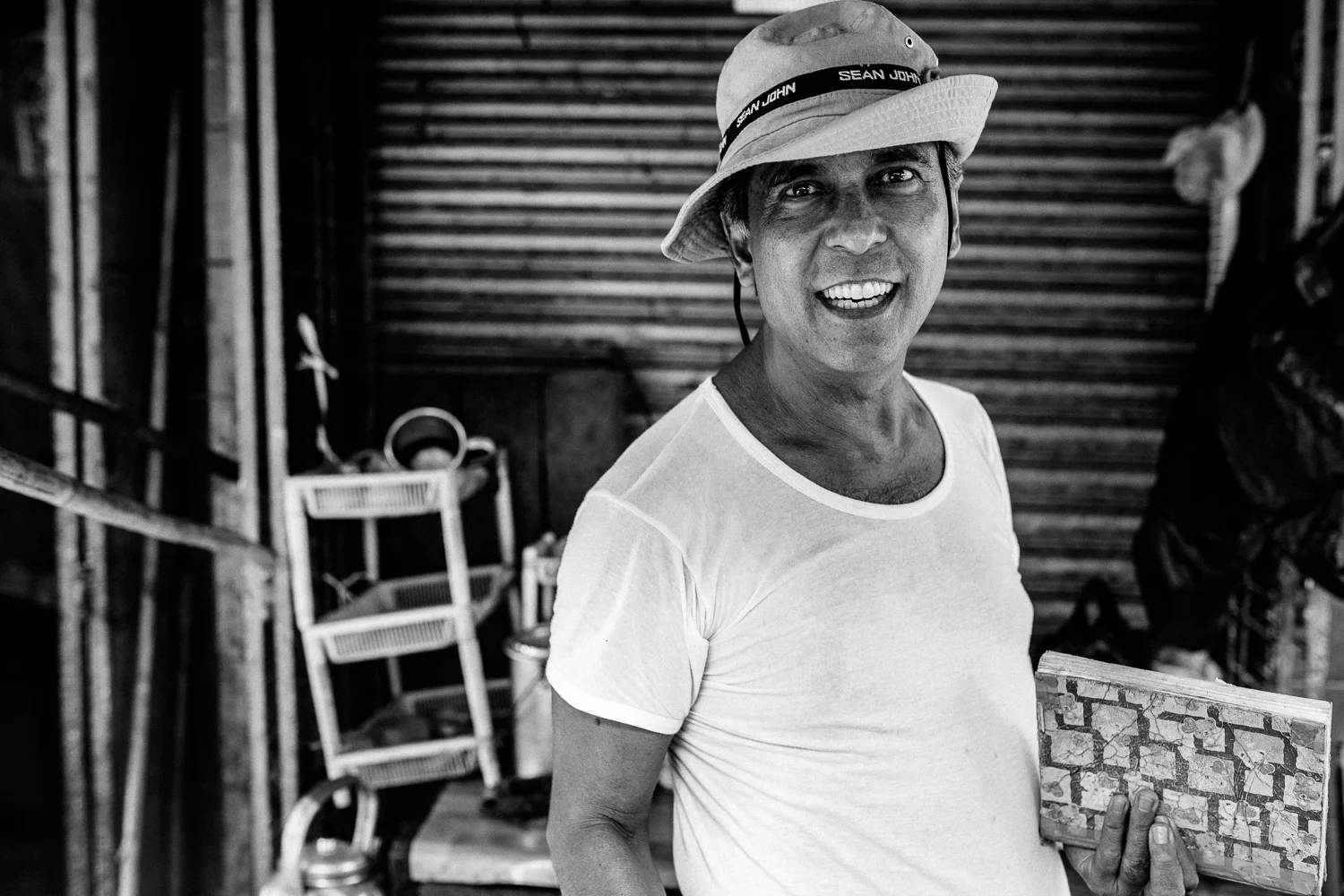 When I first saw him, he was fiercely writing notes in his journal about his sales in the market but once I said Mingalapar, he stopped writing, pulled me into his stall and took my hat then ask me to take his portrait. We spent another ten minutes talking about where we came from despite of how busy he was at that point in time.